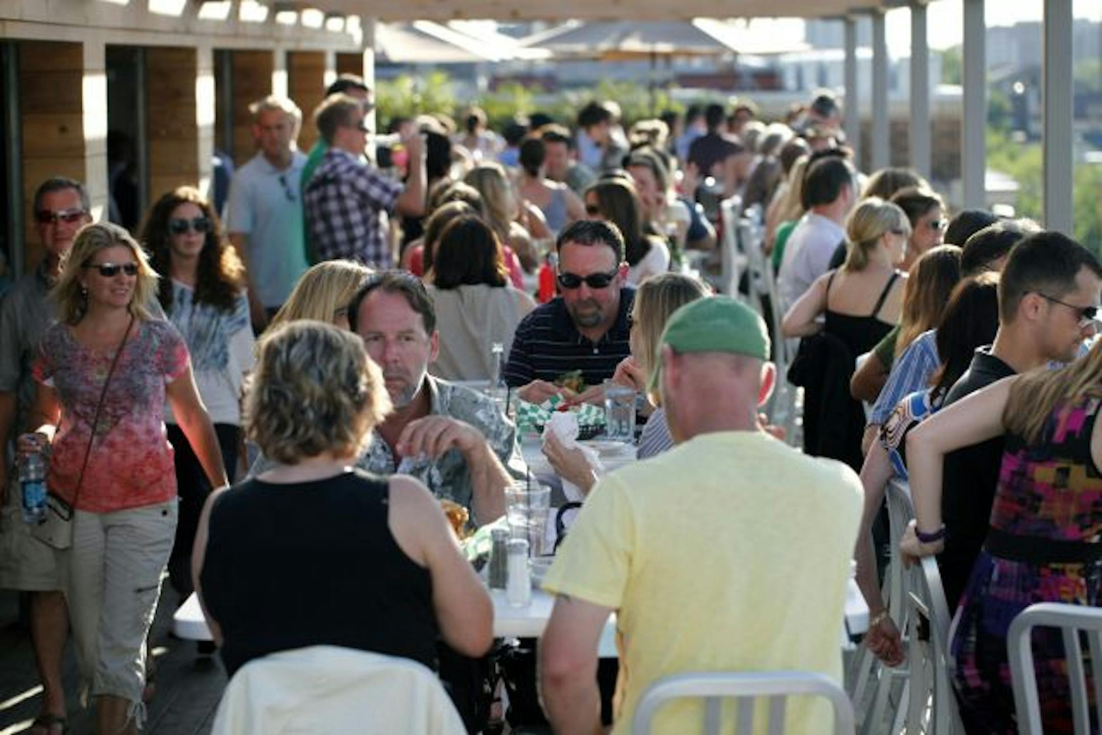 A typical full house for the rooftop patio at Uptown Cafeteria, located in a recently opened expansion of Calhoun Square.