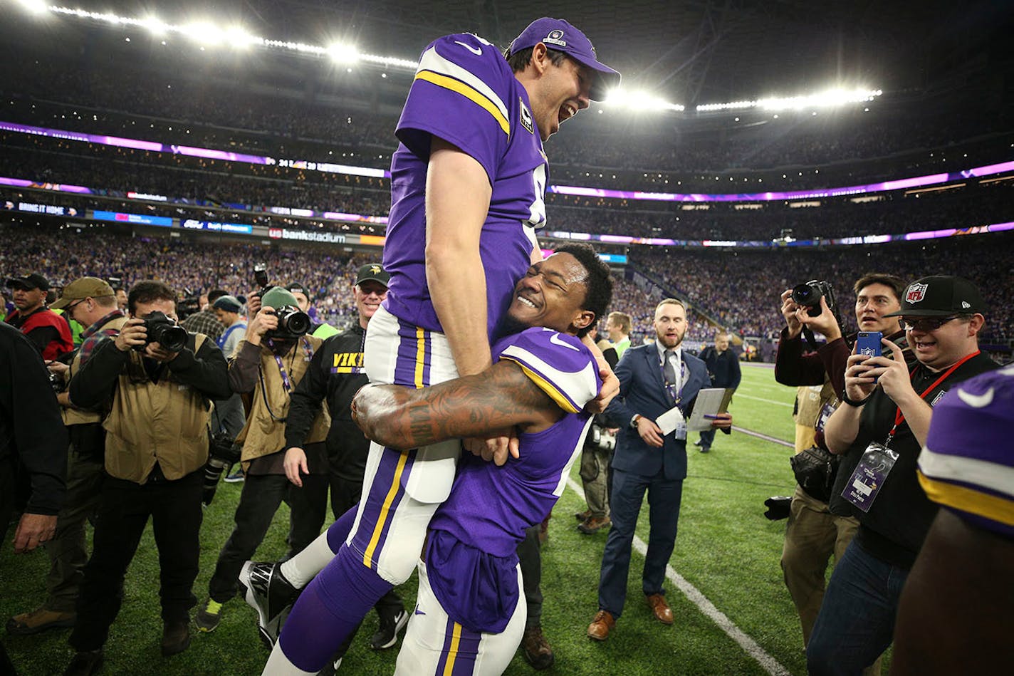 Vikings quarterback Sam Bradford was hoisted up by a jubilant Stefon Diggs after Diggs made a game-winning 61-yard touchdown catch on the last play of Sunday's NFC divisional playoff game at U.S> Bank Stadium.