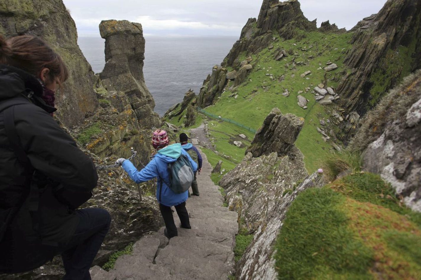 Visitors on the island of Skellig Michael, Ireland, Oct. 5, 2012. Visitors to Ireland can expect spectacular scenery, bountiful seafood and an infinity of pubs. (Derek Speirs/The New York Times) -- PHOTO MOVED IN ADVANCE AND NOT FOR USE - ONLINE OR IN PRINT - BEFORE OCT. 28, 2012. --