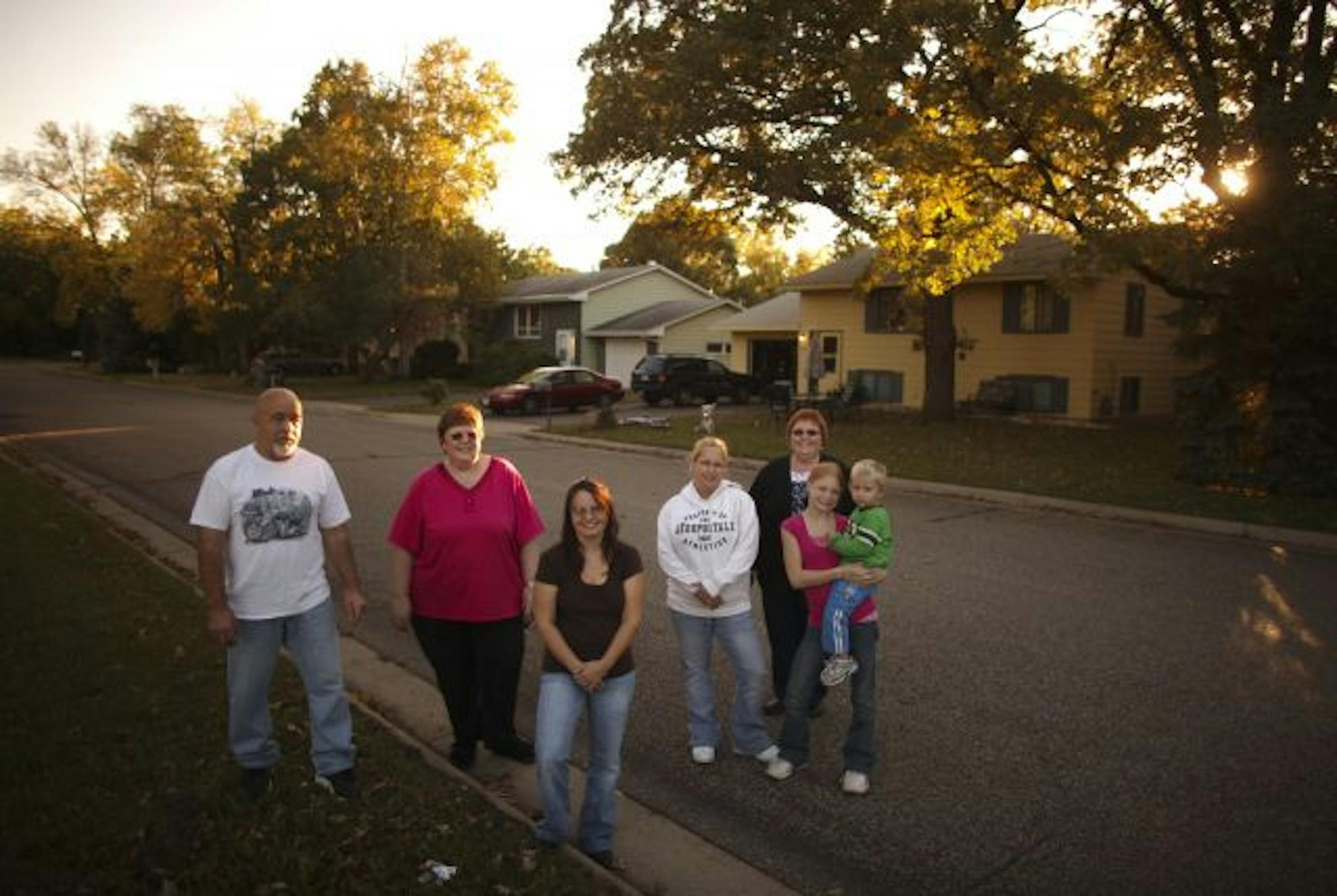 On shaky ground in Newport: Jim Doppler, left, Lana Solem, Donna Wiersgalla, Crystal Oswald, Elsie Kramer and Bailey Conklin (holding Oswald's son, Landon) gathered on 1st Avenue on Wednesday. Some in the neighborhood have reported that their houses will shake or vibrate for no apparent reason. They've asked the city for help, but so far no one has been able to come up with an explanation.