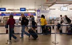 Passengers printed tickets from the kiosks at the Delta Airlines counter Wednesday at MSP. ] ANTHONY SOUFFLE &#x2022; anthony.souffle@startribune.com 