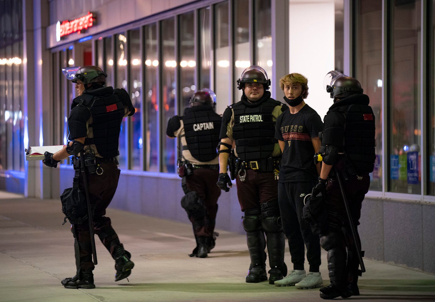 A young man was detained by State Patrol officers on S. 8th St. in Minneapolis an hour and 45 minutes after curfew Thursday.