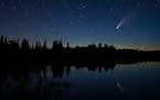 Comet Neowise in the night sky over Wolf Lake in Brimson, Minn., on July 14.