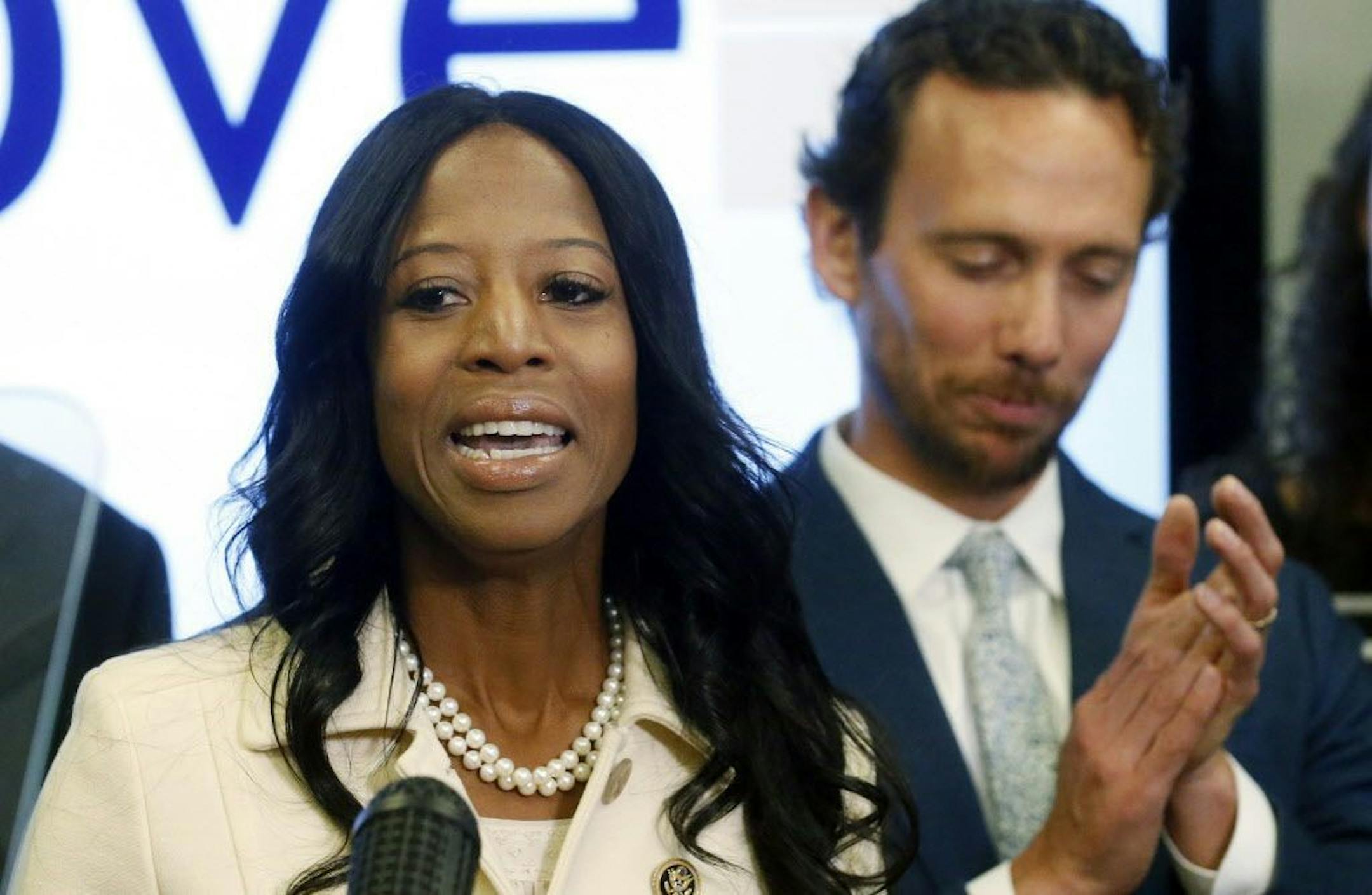 Surrounded by her family, Rep. Mia Love, R-Utah, talks about election results in the 4th Congressional District at the Utah Republican Party headquarters Monday Nov. 26, 2018, in Salt Lake City.