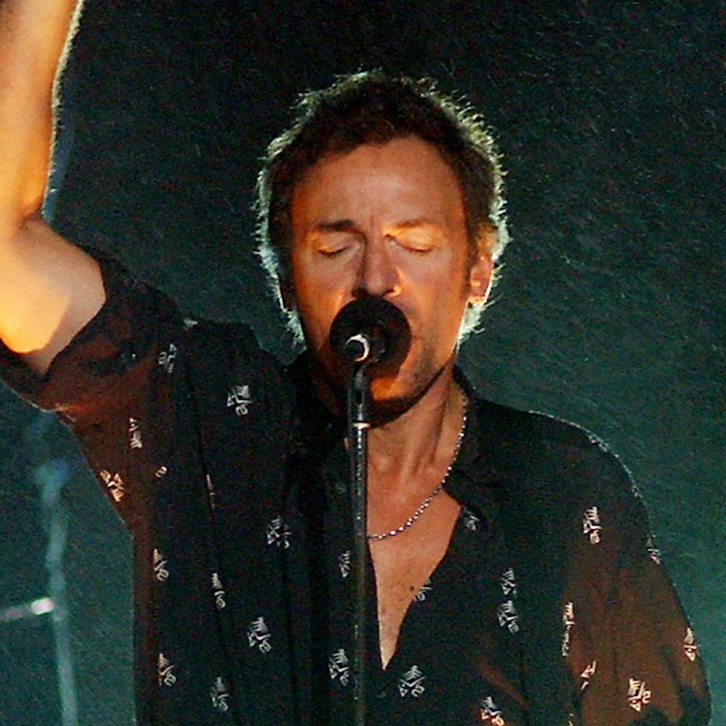 FILE - In this Aug. 29, 2002 file photo, Bruce Springsteen and the E Street band perform "The Rising" off his new album of the same name at the MTV Video Music Awards at the American Museum of Natural History, in New York. Springsteen opened the show by performing his Sept. 11-inspired song outside the museum - punctuated by a mist of rain. (AP Photo/Stephen Chernin, File)