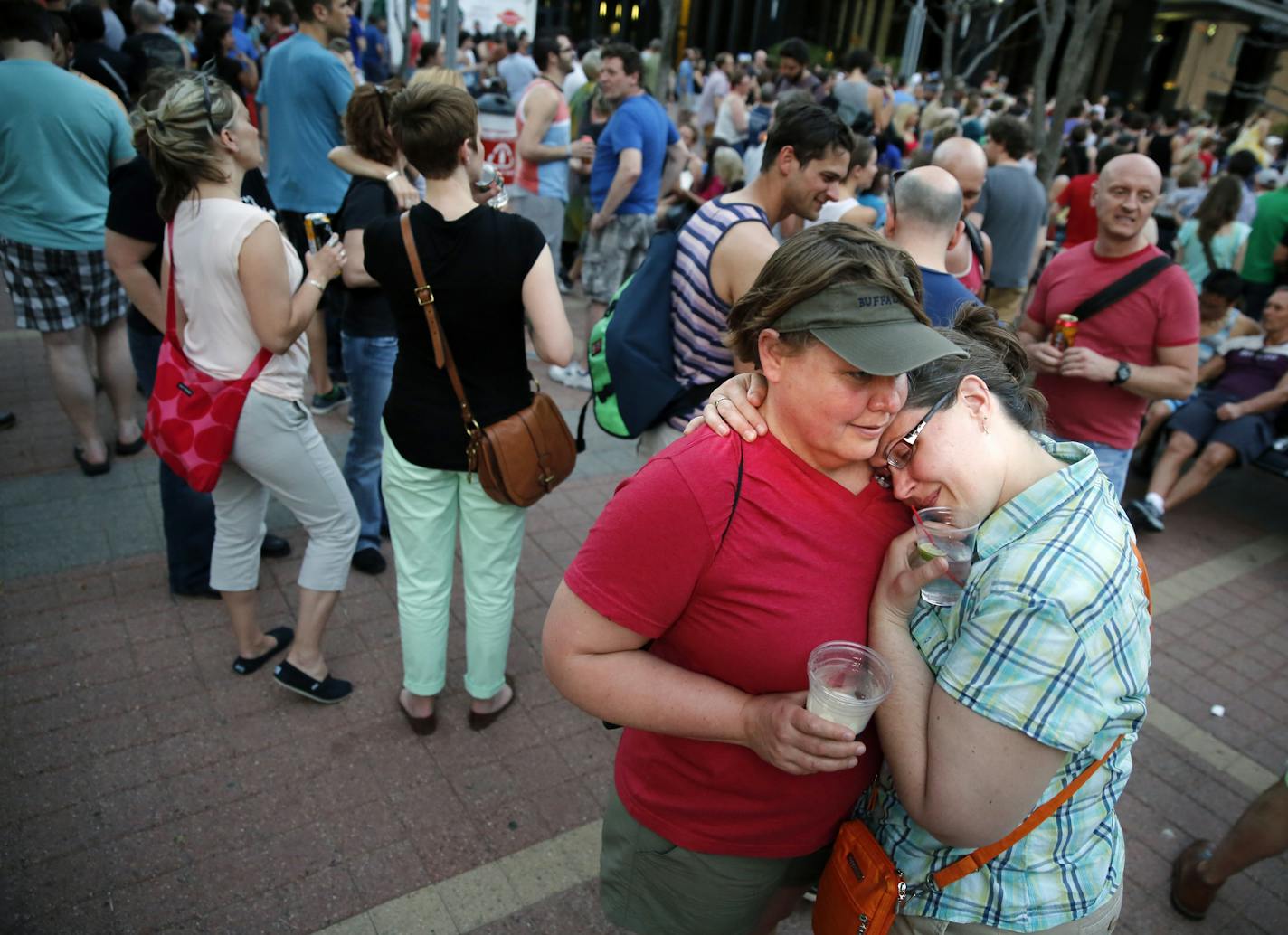 In downtown St. Paul at the EcoLab Plaza, Tamara Simonich and Jennifer Conrad enjoyed the celebration of gay marriage being legalized in Minnesota. "It's a huge deal," says Simonich.]rtsong-taatarii@startribune.com