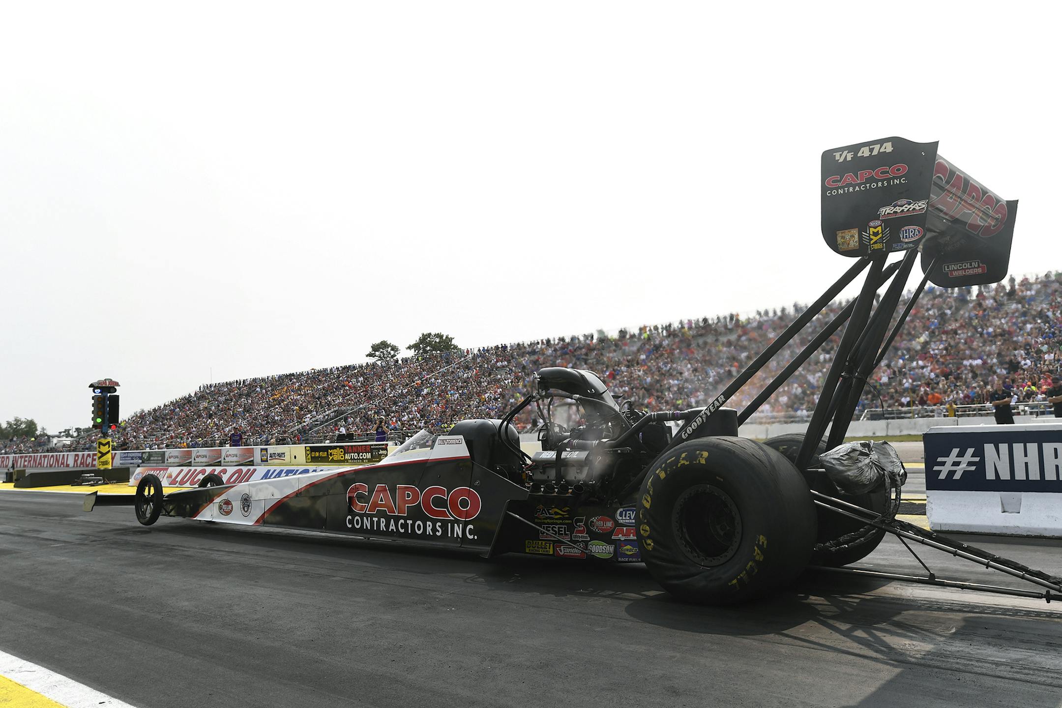 In this photo provided by the NHRA, Billy Torrence drives to the Top Fuel No. 1 qualifier at the annual Lucas Oil NHRA Nationals at Brainerd International Raceway in Brainerd, Minn., Saturday, Aug. 18, 2018. (Marc Gewertz/NHRA via AP)