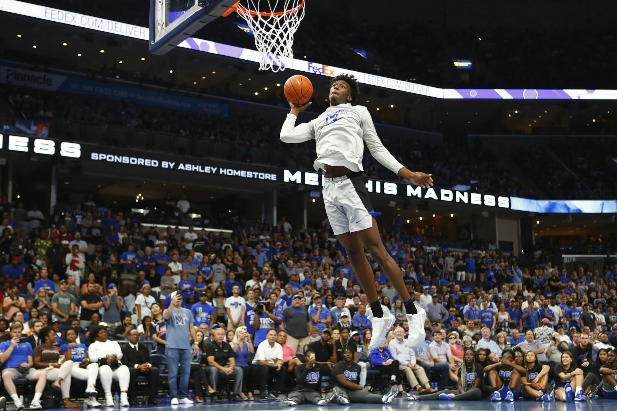 FILE - In this Oct. 3, 2019, file photo, Memphis freshman center James Wiseman dunks the ball during Memphis Madness in Memphis, Tenn. Wiseman headlines the nation’s top recruiting class at Memphis, but he isn’t the only first-year player that figures to make an impact this season. (Joe Rondone/The Commercial Appeal via AP, File) ORG XMIT: TNMEM501