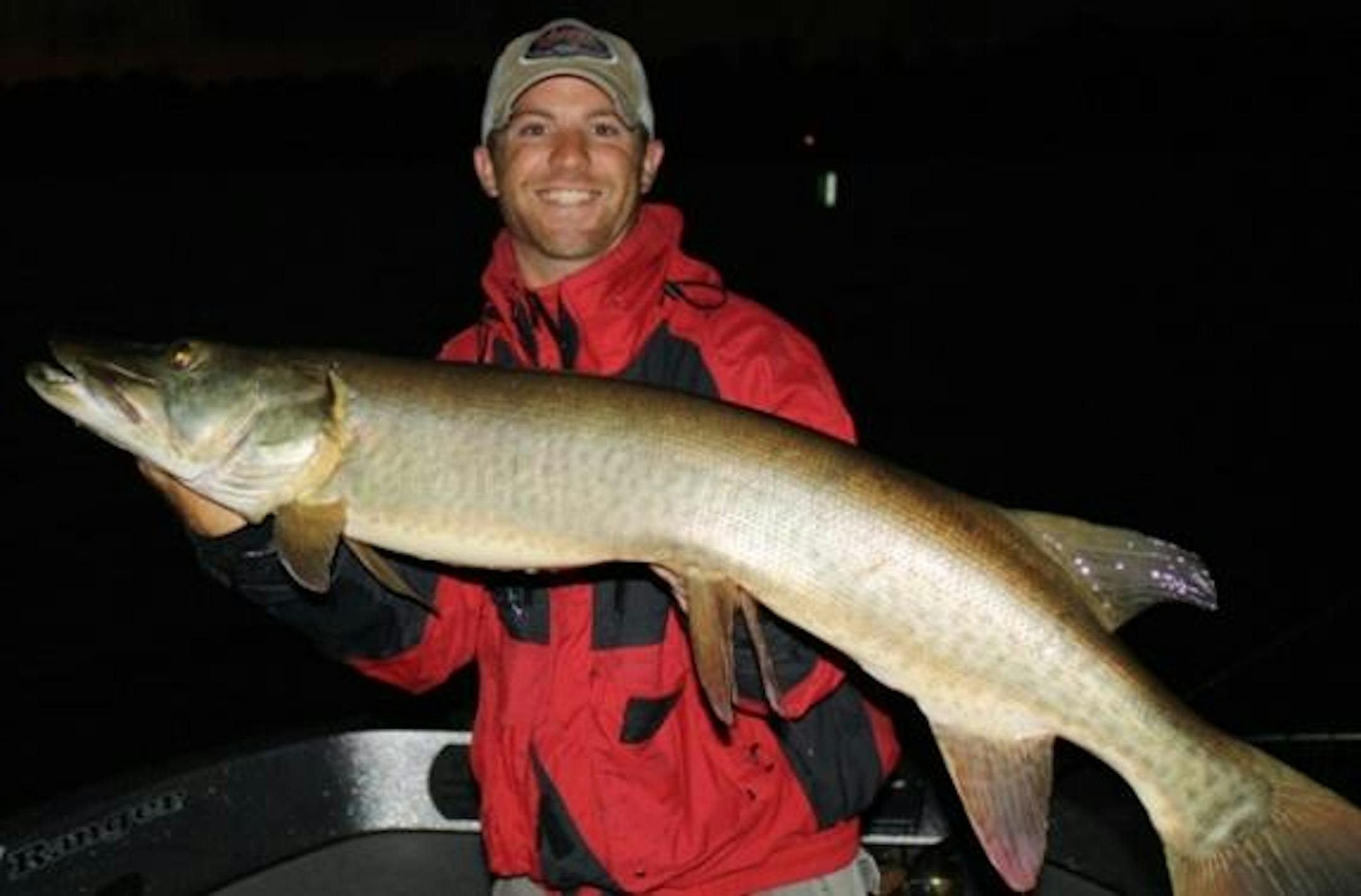 The author, Travis Frank holds a recent 47 inch muskie caught out from the metro waters.
