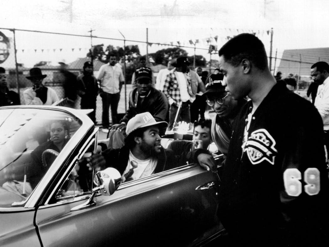 Writer/director John Singleton (second from right) discusses a scene with Ice Cube (in driver's seat) and Cuba Gooding, Jr. (right) in 'Boyz N the Hood.' Also in the car are Regina King and (back seat, left to right) Redge Green and Dedrick D. Gobert.