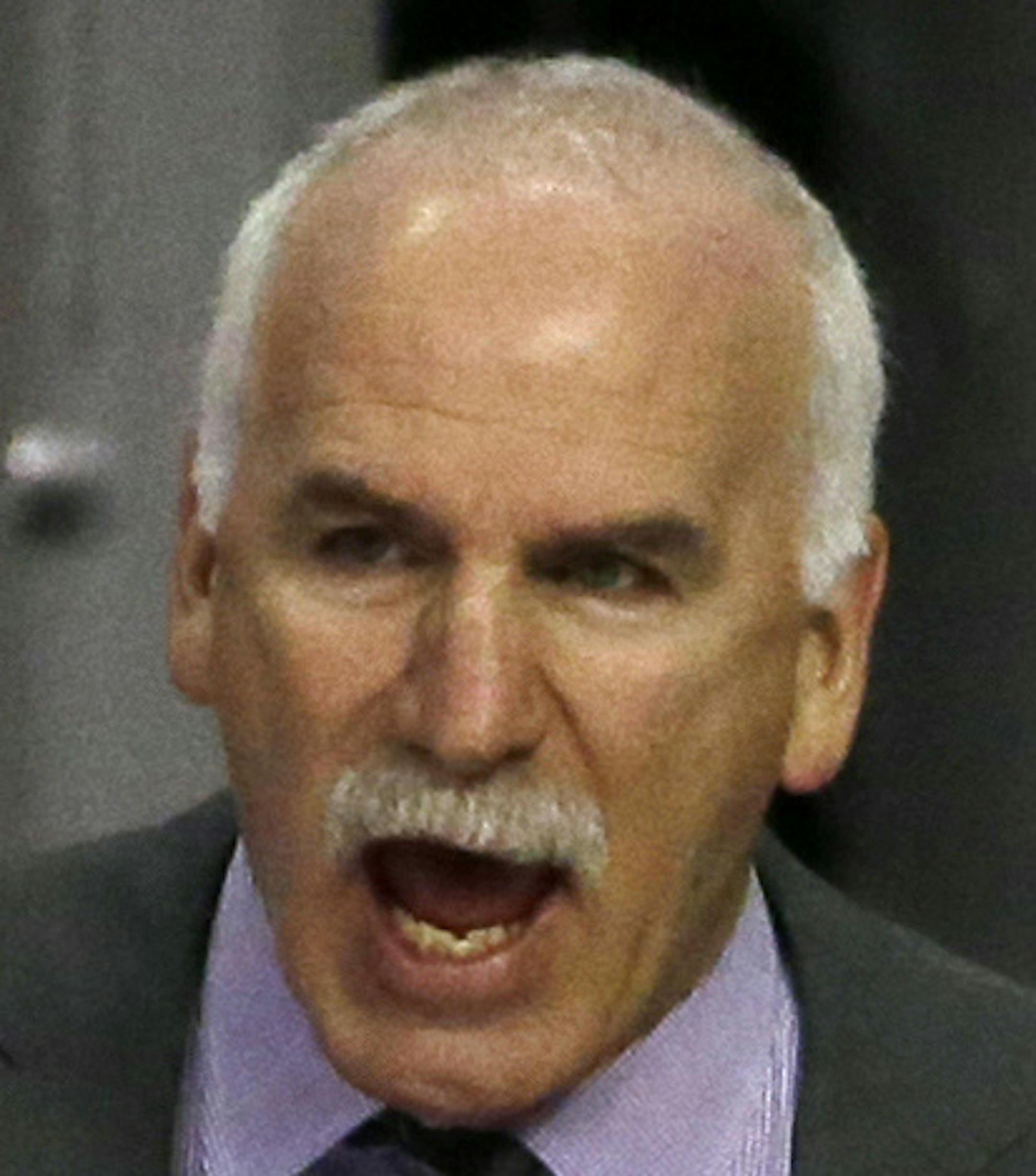Chicago Blackhawks head coach Joel Quenneville, top, talks to his team during the third period of an NHL hockey game against the Dallas Stars Thursday, Feb. 11, 2016, in Chicago. The Stars won 4-2. (AP Photo/Nam Y. Huh)