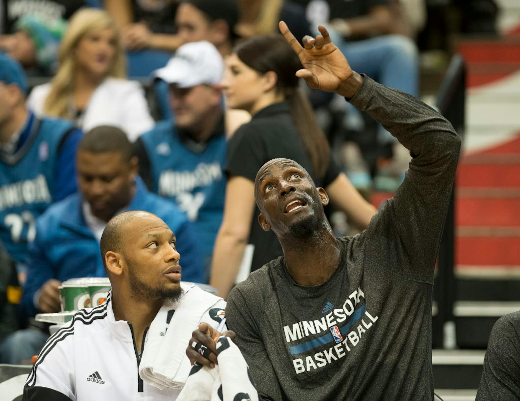 Minnesota Timberwolves forward Adreian Payne (3) receives advice from forward Kevin Garnett (21) on the bench toward the beginning of the second half on Wednesday night. ] (Aaron Lavinsky | StarTribune) The Minnesota Timberwolves play the Washington Wizards on Wednesday, Feb. 25, 2015 at Target Center.