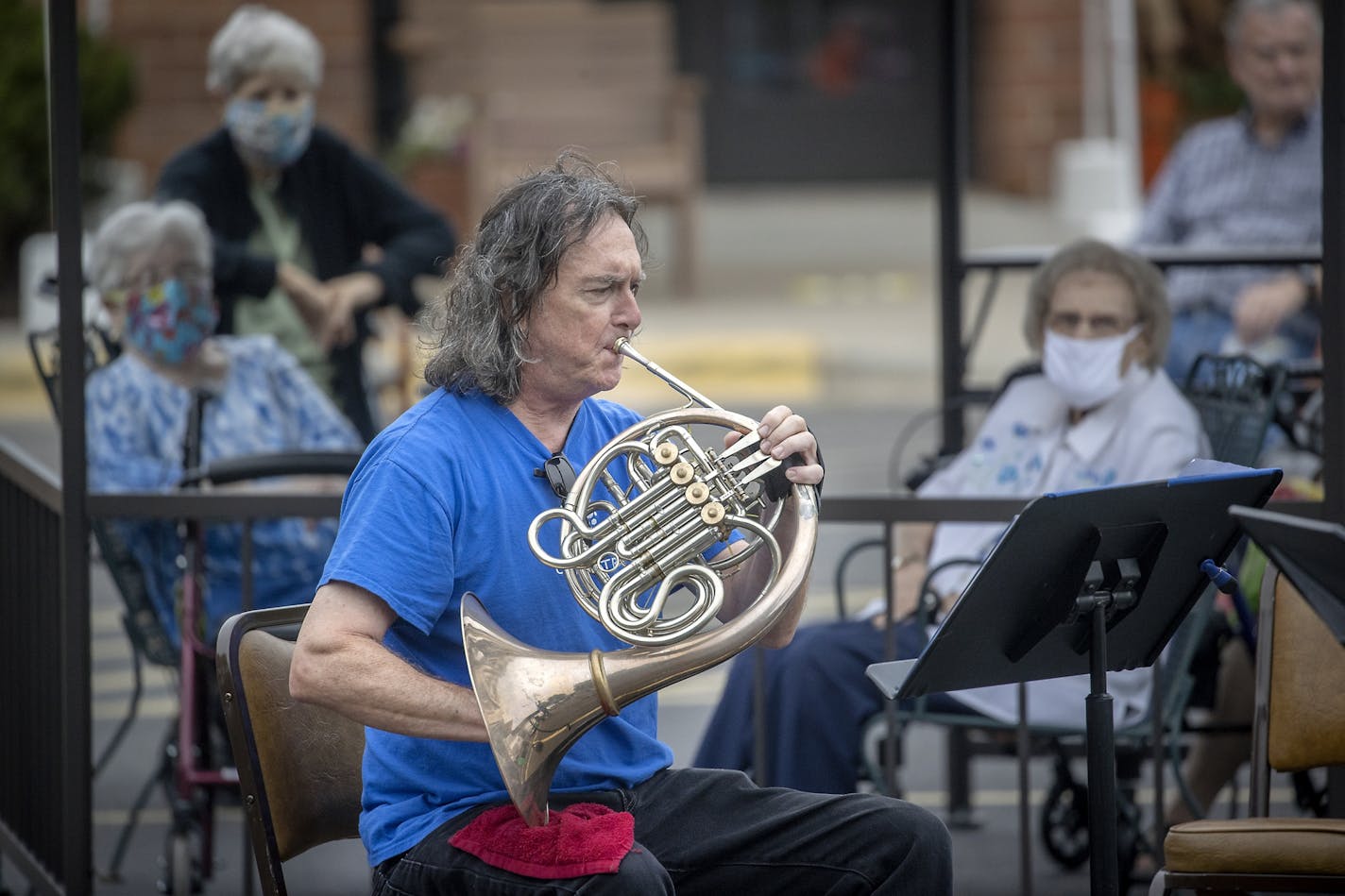 Minnesota Orchestra brass ensemble member Michael Gast performed before Lyngblomsten Senior Center residents, Thursday, Aug. 27, in St. Paul. This past spring and summer, many Minnesotans socialized outdoors as relief from sheltering in place. But winter's arrival will further cramp our already corona­virus-restricted lifestyles.