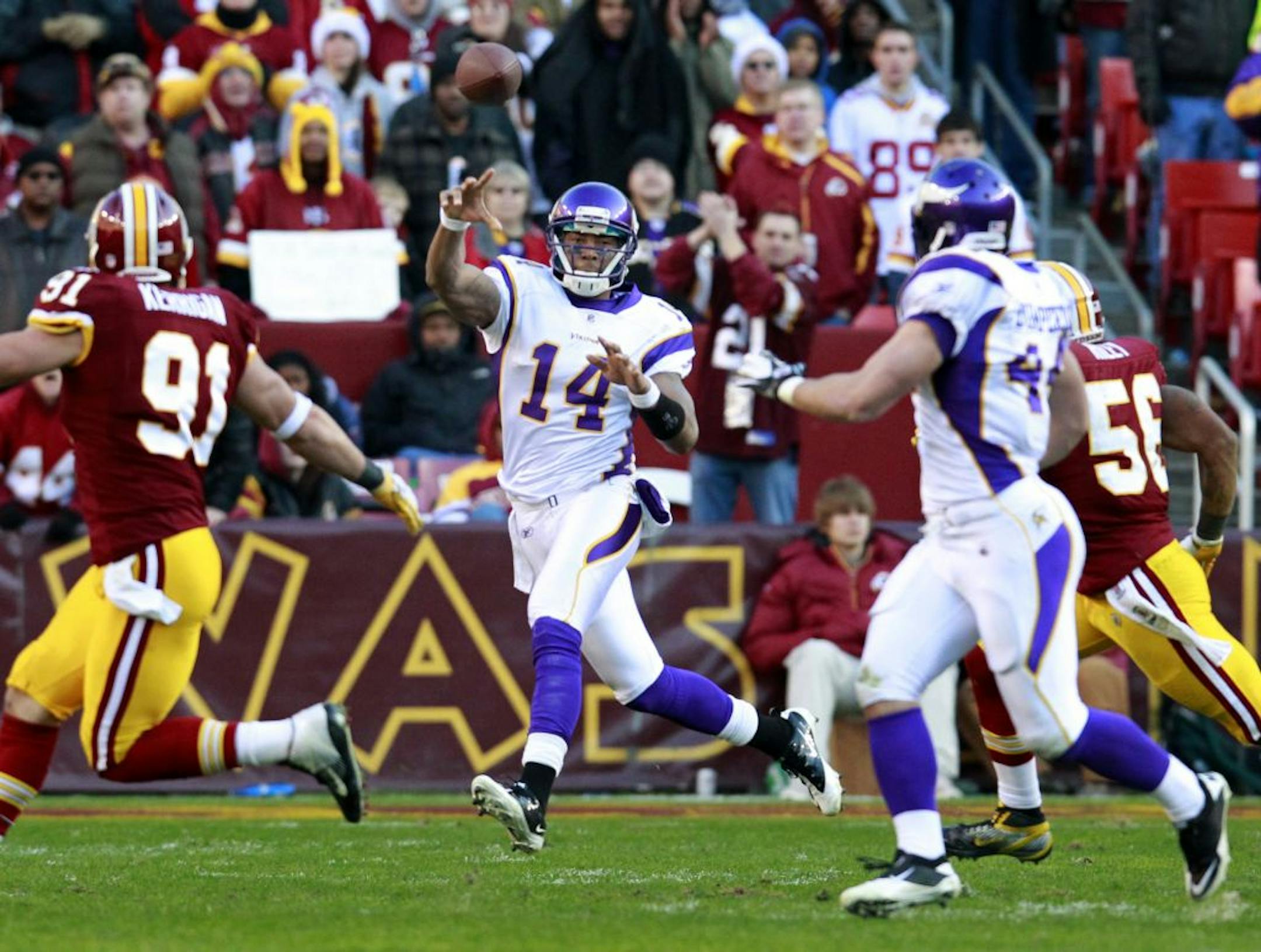 Reserve quarterback Joe Webb (14) led the Vikings over the Redskins last December, but the victory was costly in terms of dropping from No. 2 to No. 3 in the NFL draft order.