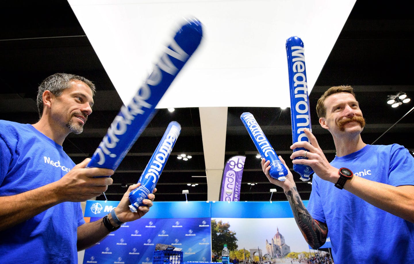 Mike Neys and Jon Osmond handed outMedtronic boppers so supporters could make noise at the race. Medtronic Twin Cities Marathon Health and Fitness Expo at St. Paul's RiverCentre. ] GLEN STUBBE * gstubbe@startribune.com Friday, October 2, 2015