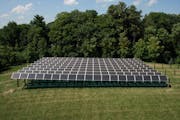Xcel plans to build more solar arrays like this one, the first community solar array in Minnesota, which was set up in Rockford earlier this year by t