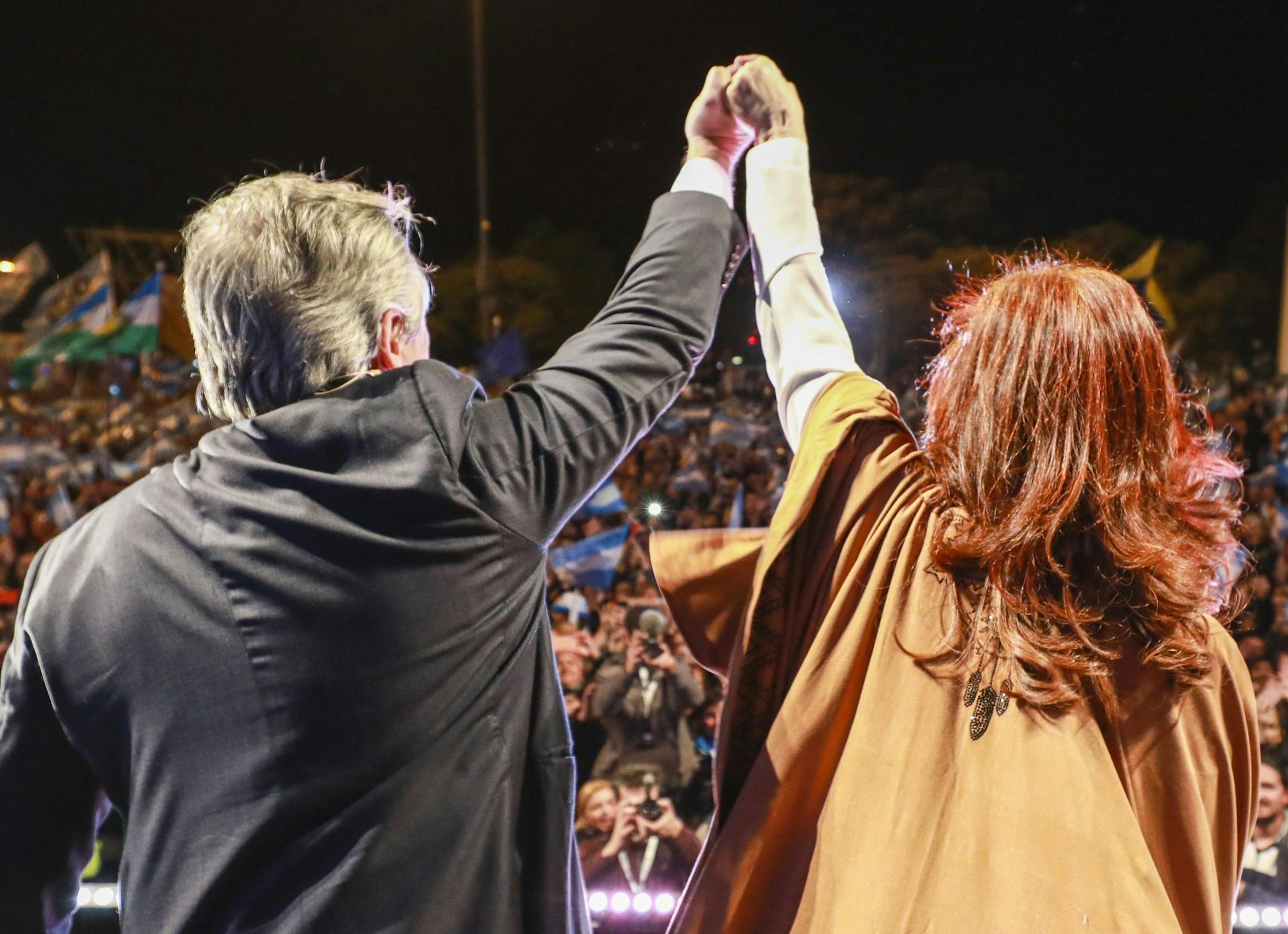 In this photo released by the "Frente de Todos" political party, Alberto Fernandez, left, and Cristina Fernandez, former president and first lady, campaign to be the presidential ticket for the "Frente de Todos" party ahead of primary elections in Rosario, Argentina, Wednesday, Aug. 7, 2019. Argentina will hold primary elections on Sunday ahead of October's presidential elections. (Frente de Todos via AP) ORG XMIT: NAT102