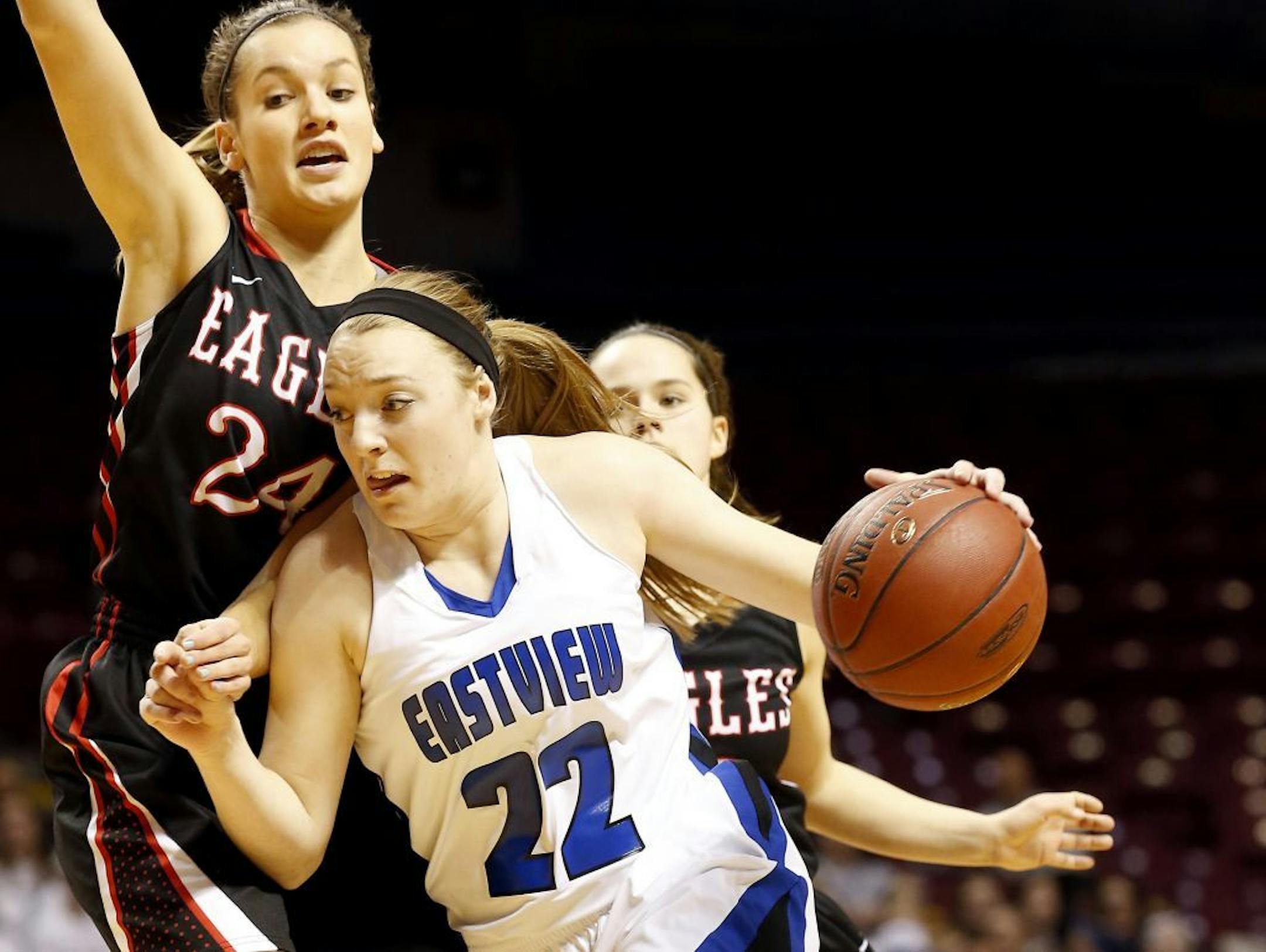 Madison Guebert (22) of Eastview was defended by Martha Kuderer (24) of Eden Prairie fought in the first half.