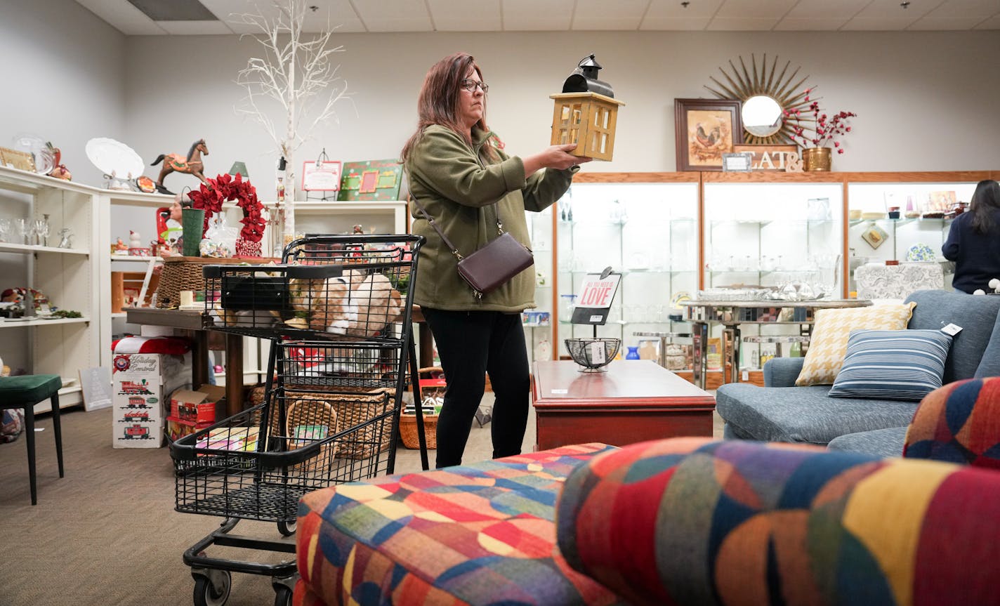 Long-time shopper Sandy Solberg checked out the offerings at Resale Select thrift store Tuesday, Oct. 24, 2023 Plymouth, Minn. ] GLEN STUBBE • glen.stubbe@startribune.com