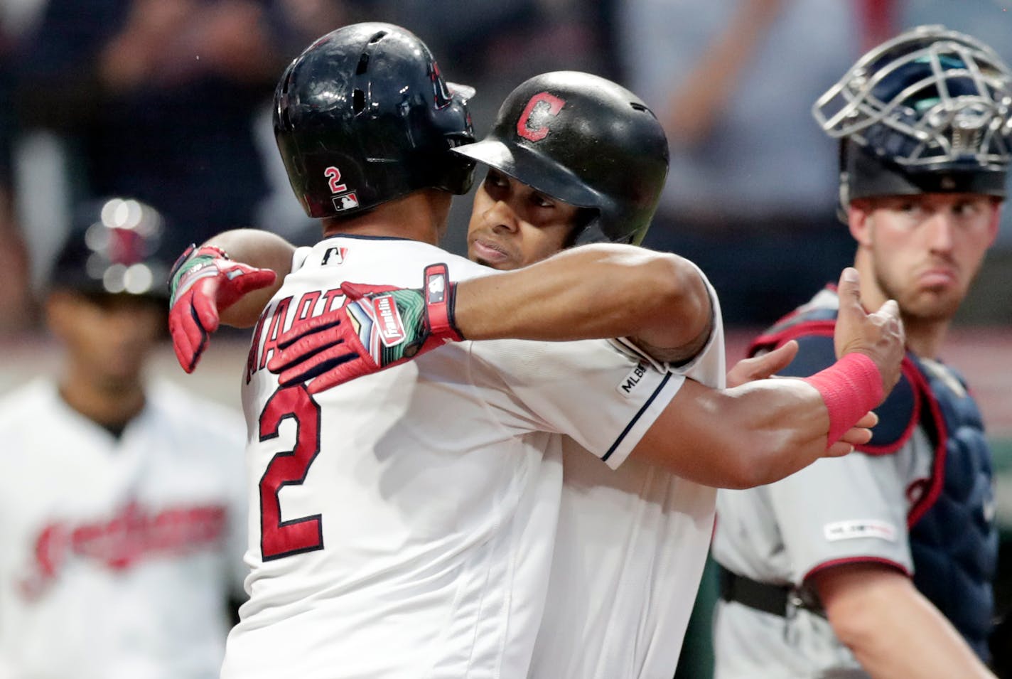 Cleveland's Francisco Lindor, center, hugs Leonys Martin after Lindor hit a two-run home run off Twins pitcher Devin Smeltzer in the fifth inning.