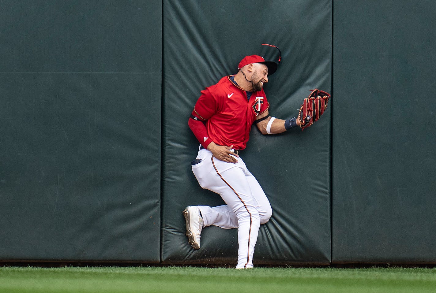 Twins centerfielder Royce Lewis snagged a fly ball hit by Kansas City Royals third baseman Emmanuel Rivera (26) in the third inning in Minneapolis, Minn., on Sunday, May 29, 2022. Lewis was injured on the play after he collided with the wall.