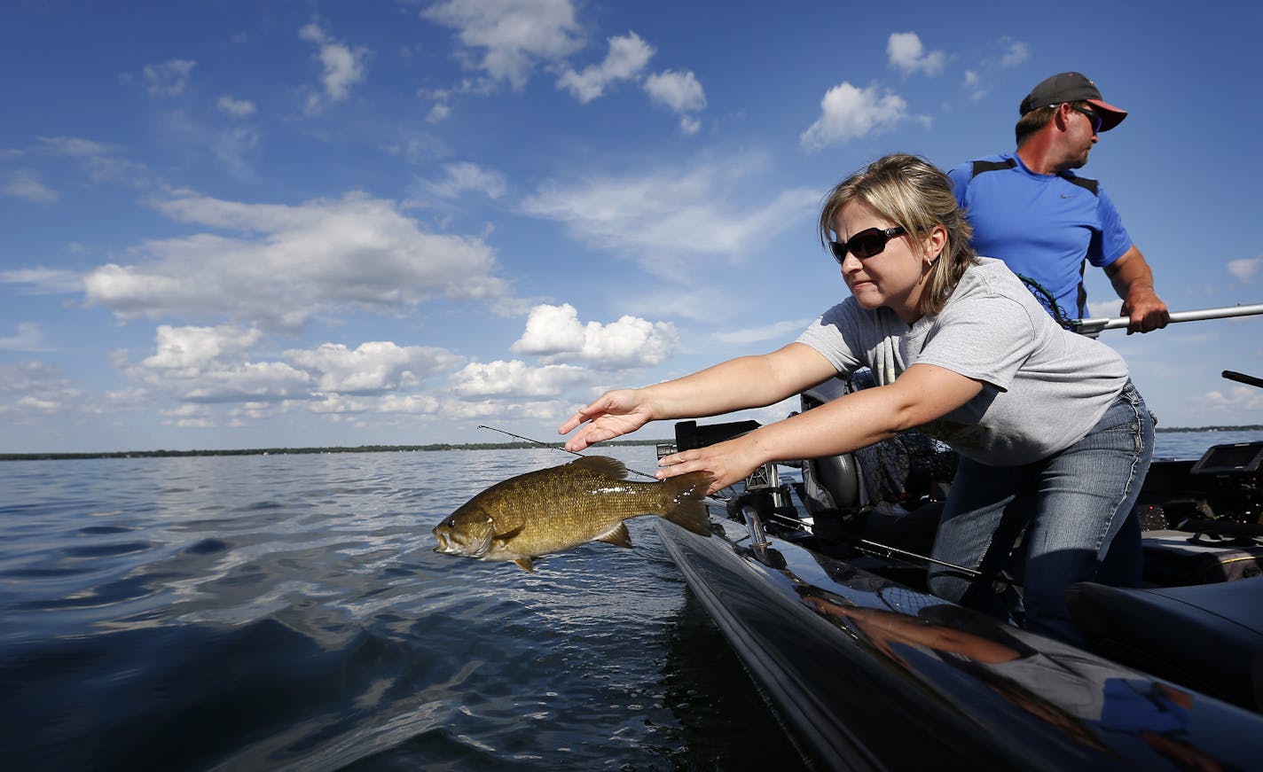 Suzy Anderson tossed back a smallmouth bass into Lake Mille Lacs on Tuesday.