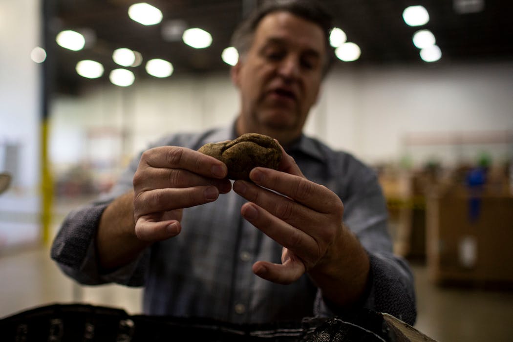 Bob Branham, director of produce strategy at Second Harvest Heartland, showed a misshapen potato.