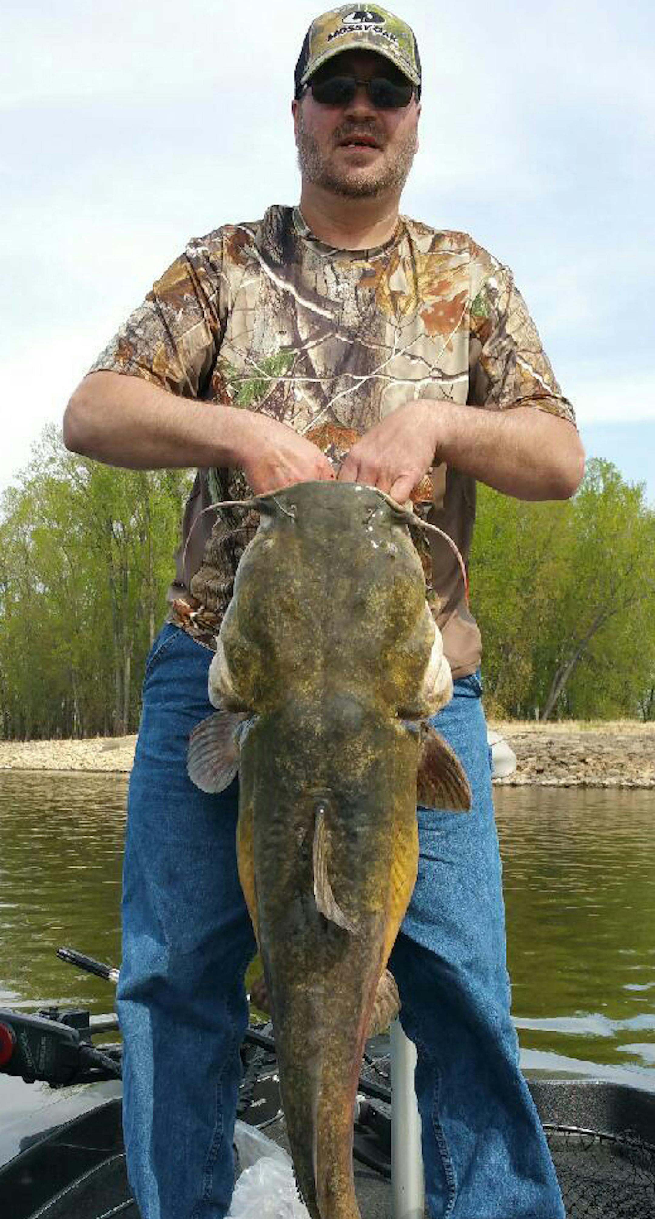 BIG CAT Eric Wollenberg of Hager City, Wis., was fishing for walleyes earlier this month on the Mississippi River when this 45-inch, 40-pound flathead catfish struck. "I was fishing with an ultralight and a jig,'' he said, and fought the fish for a half hour. "We took some pictures and released her. It's the biggest fish I've ever caught.''