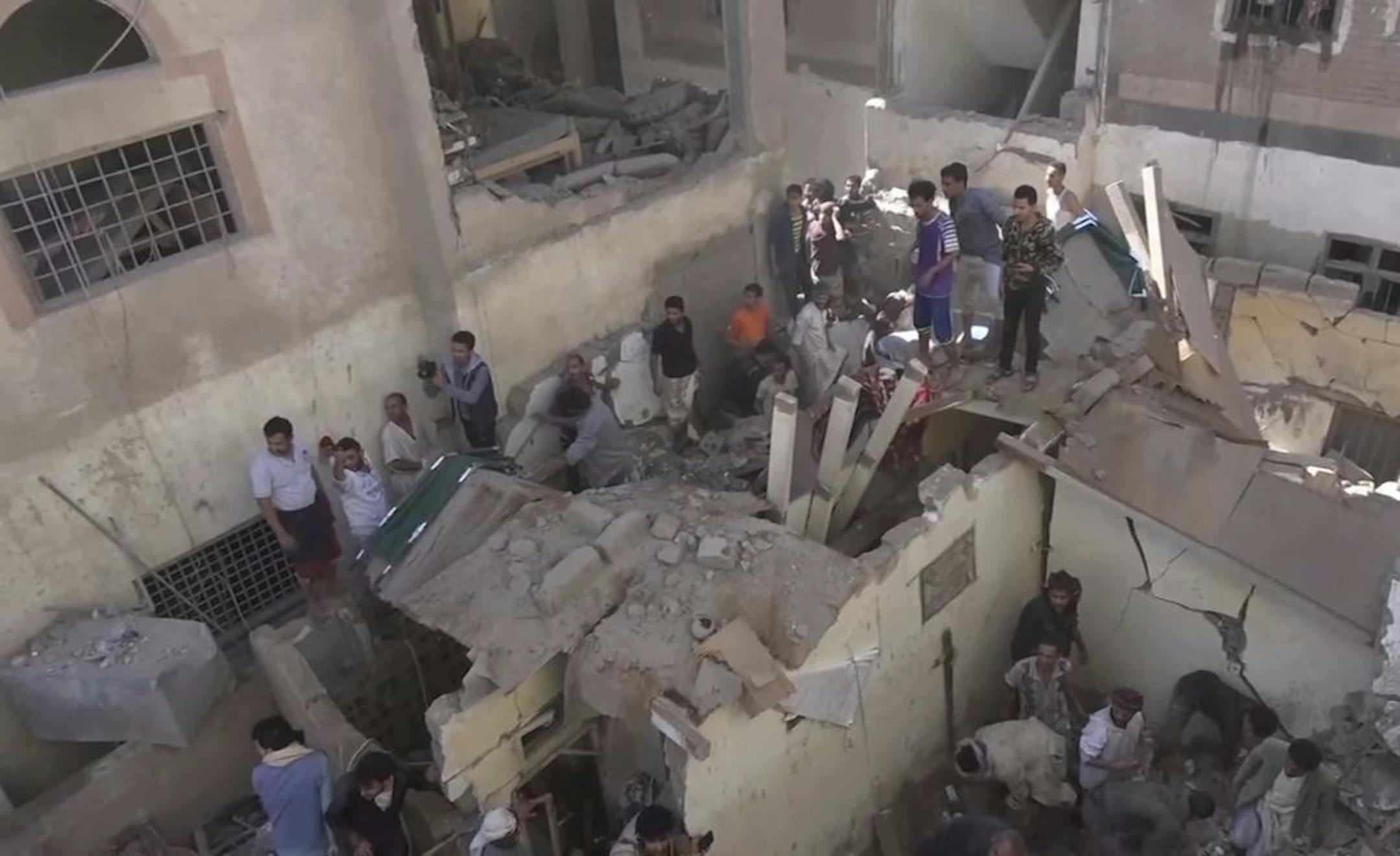 In this frame grab from from video, people search in the rubble following Saudi-led coalition airstrikes that killed at least six, including children, officials said, in the residential center of the capital, Sanaa, Yemen. The Sanaa airstrikes came after Yemen's Iran-backed Houthi rebels, who control the capital, launched a drone attack earlier in the week on a critical oil pipeline in Saudi Arabia, Tehran's biggest rival in the region.