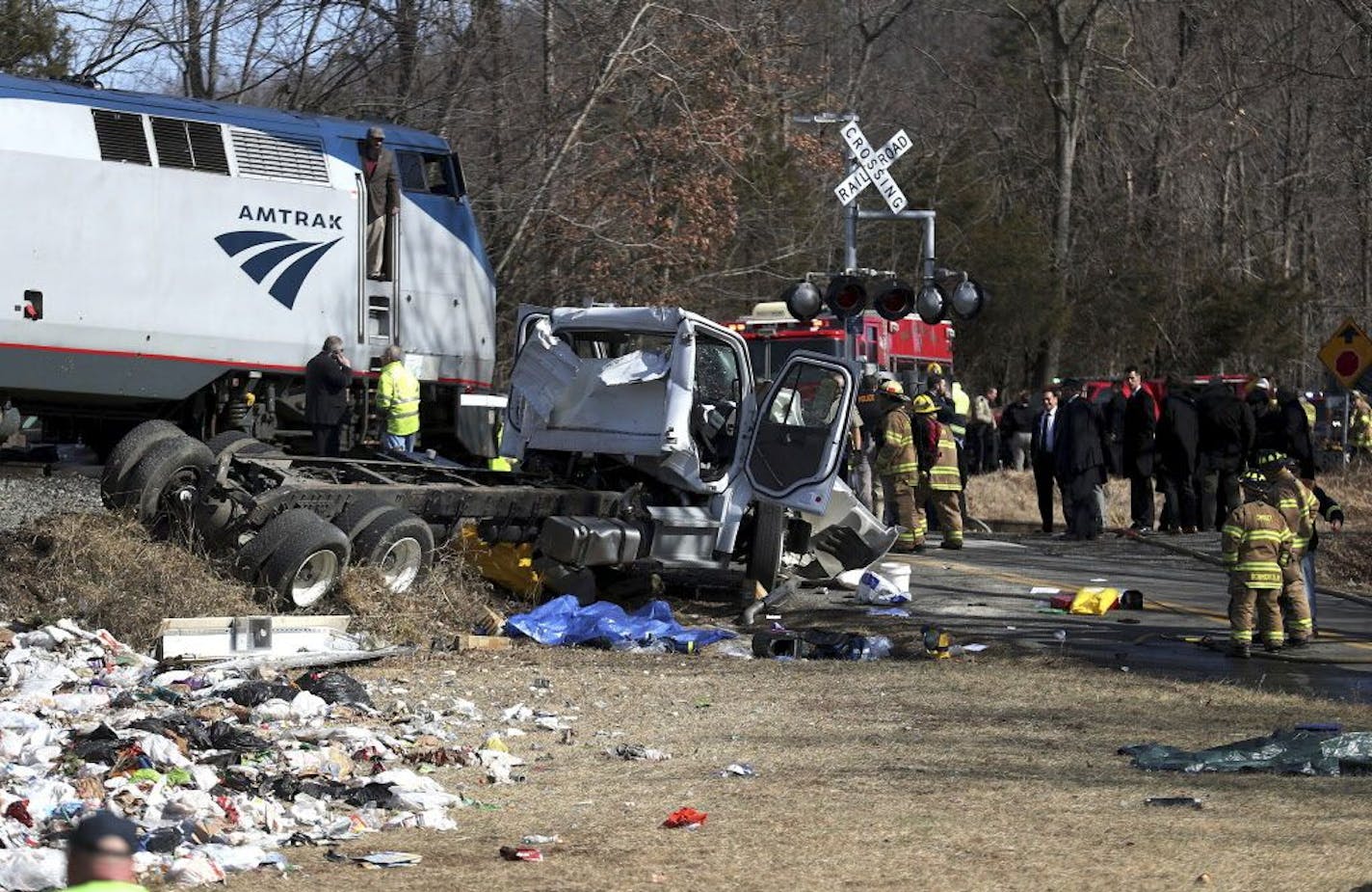 Emergency personnel work at the scene of a train crash involving a garbage truck in Crozet, Va., on Wednesday, Jan. 31, 2018. An Amtrak passenger train carrying dozens of GOP lawmakers to a Republican retreat in West Virginia struck a garbage truck south of Charlottesville, Va. No lawmakers were believed injured.