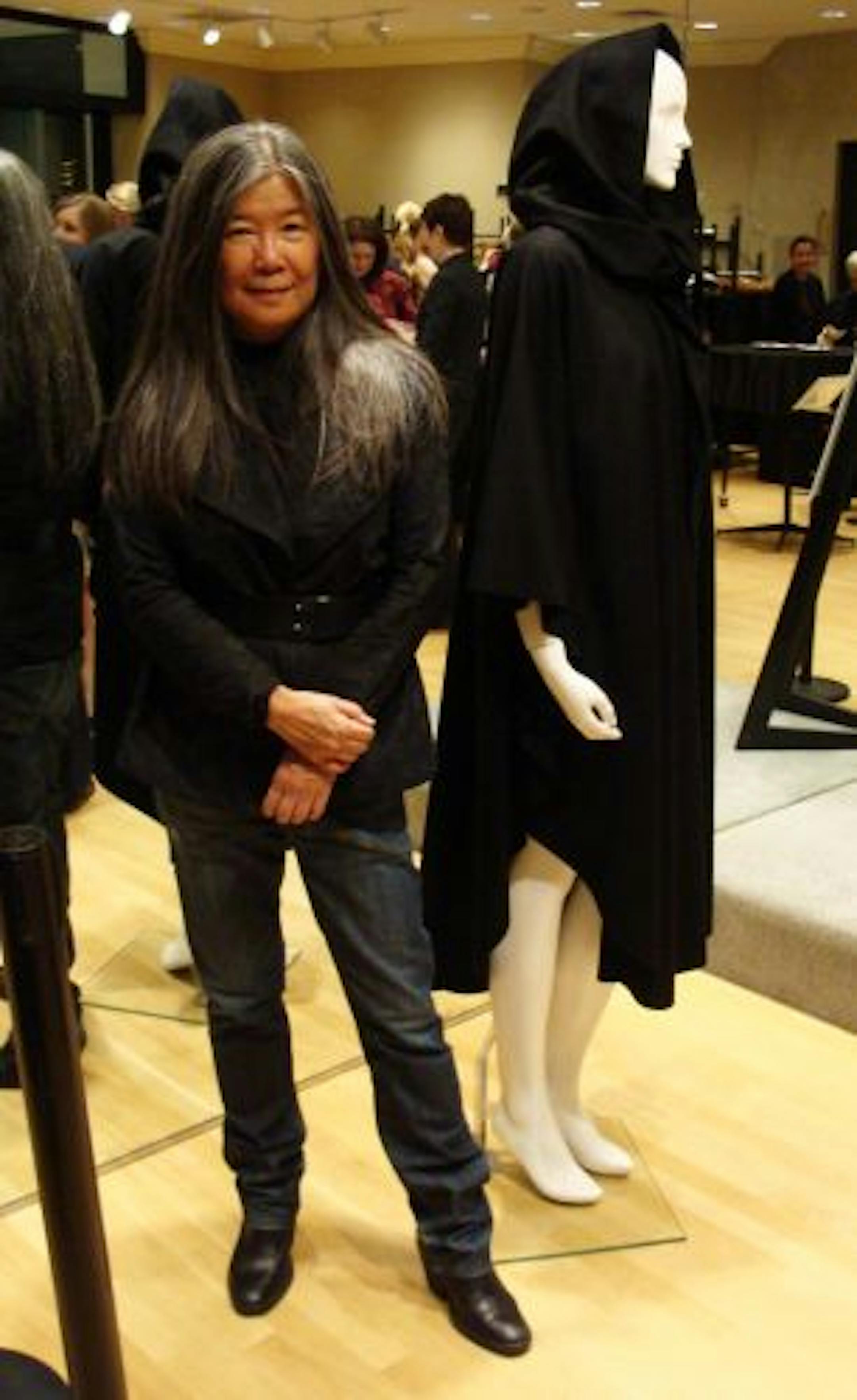 Designer Yeohlee Teng at JV & Company in Minneapolis with the Teflon wool cashmere open back cape from her fall 2007 collection that she donated to the Goldstein Museum of Design.