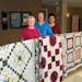 The St. John’s Fall Festival in Jordan includes an auction featuring quilts handmade by women in the parish. Pictured from left are Helene Schmitt, 