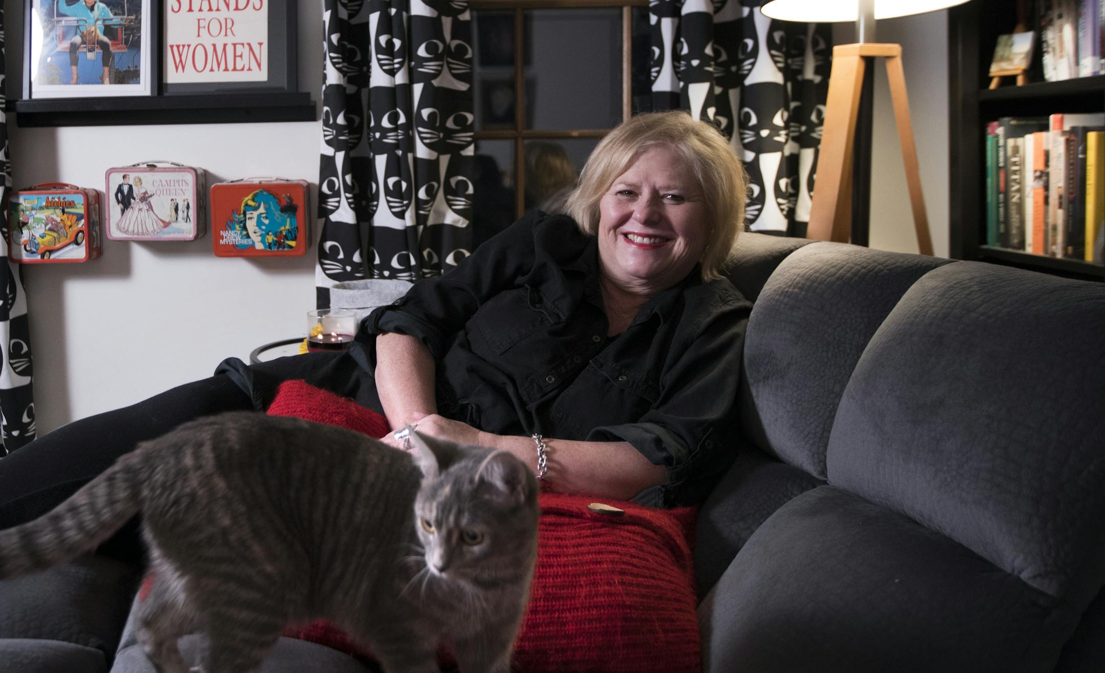 Christine Alexander poses for a photo inside her "Lady Lounge" with her cat Ingeborg. ] LEILA NAVIDI ï leila.navidi@startribune.com BACKGROUND INFORMATION: Christine Alexander poses for a photo inside her "Lady Lounge" in her Vadnais Heights home on Thursday, March 1, 2018.