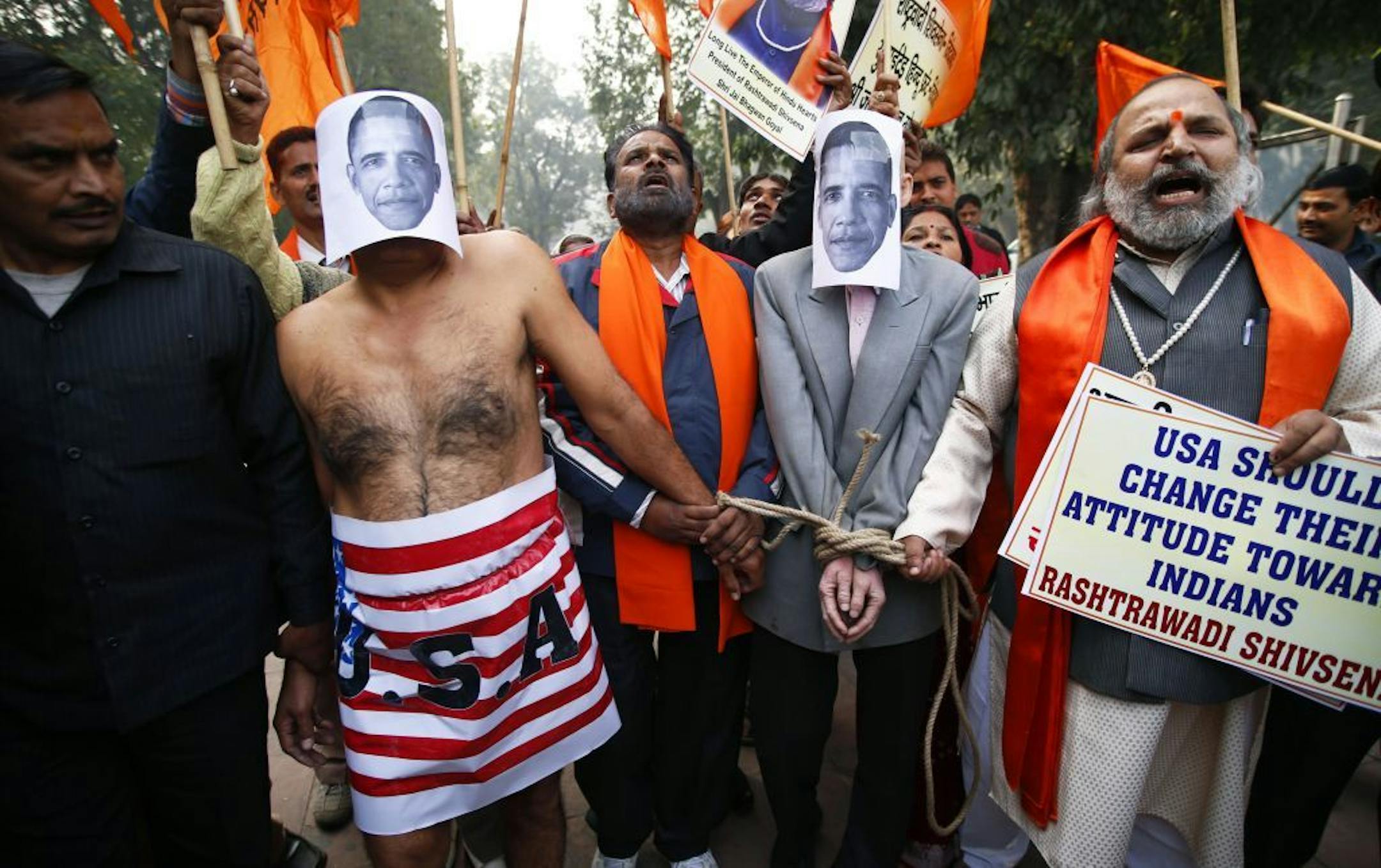 People in New Delhi, India, gather near the U.S Embassy on Wednesday, Dec. 18, 2013 to protest against the alleged mistreatment of New York based Indian diplomat Devyani Khobragade.
