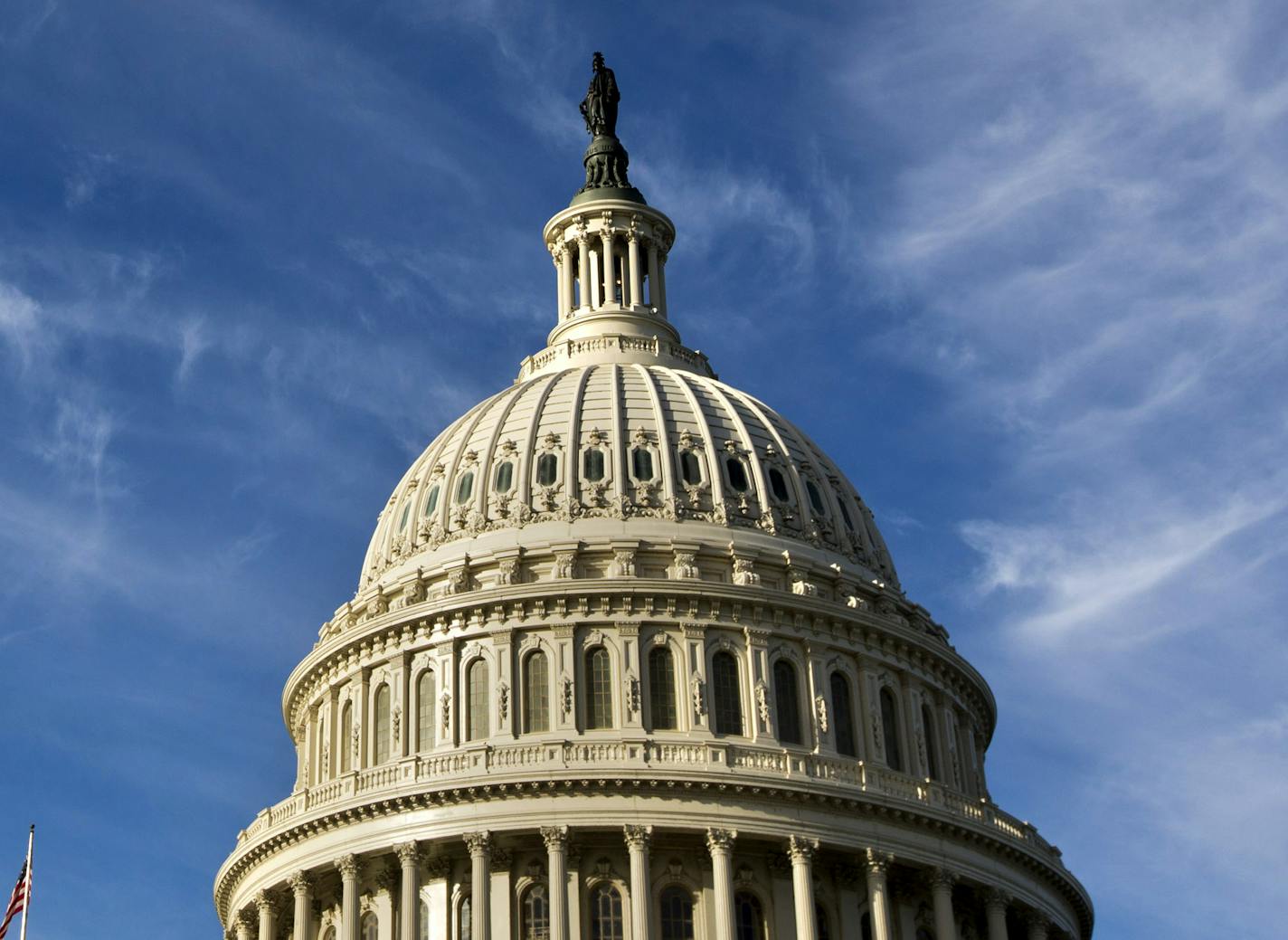 Cirrus clouds float high above the Capitol in Washington, Wednesday, Sept. 25, 2013, as Sen. Ted Cruz, R-Texas continues his lengthy speech in opposition to President Barack Obama's health care law. The Democratic-controlled Senate is on a path toward defeating tea party attempts to dismantle President Barack Obama's health care law, despite an overnight talkathon on the chamber's floor led by Texas Sen. Ted Cruz. (AP Photo/Jacquelyn Martin)