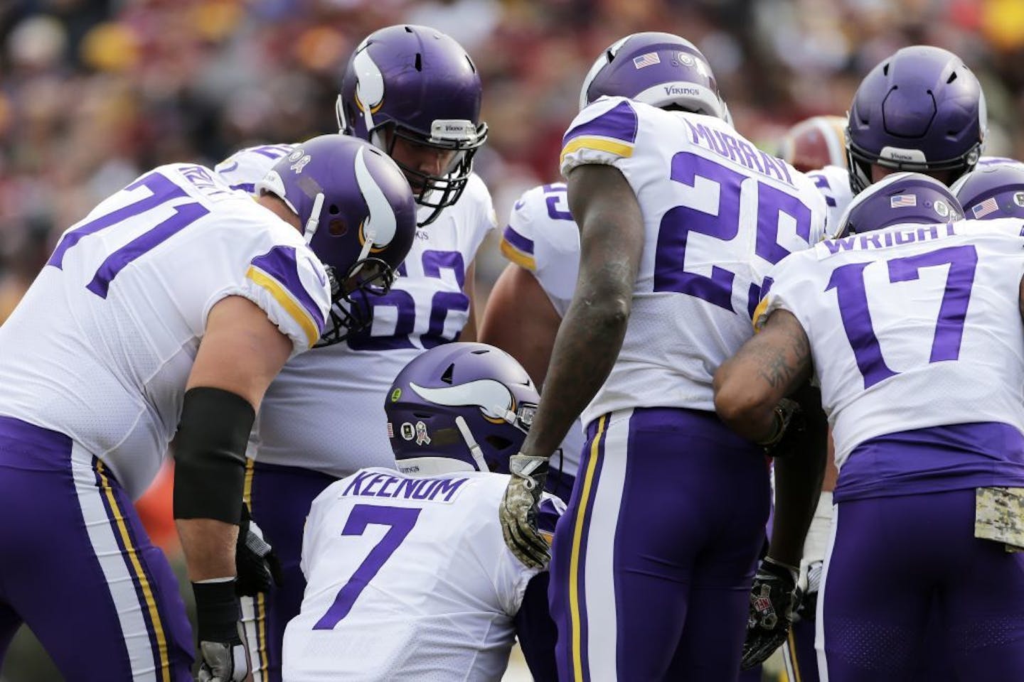 Minnesota Vikings quarterback Case Keenum (7) huddles the offense during an NFL football game against the Washington Redskins, Sunday, Nov. 12, 2017, in Landover, Md.