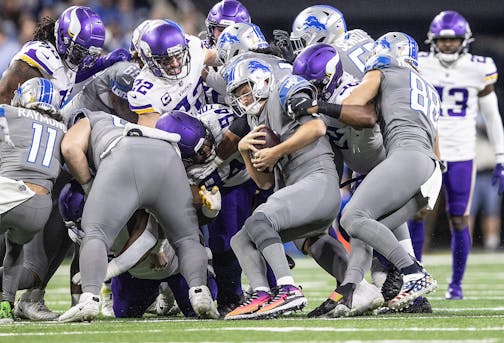 The Vikings defense stops Lions quarterback Jared Goff on a fourth and 1 in the first quarter Sunday in Detroit.