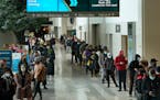 People waited in long lines Tuesday to get tested for COVID-19 at the Minneapolis Convention Center.