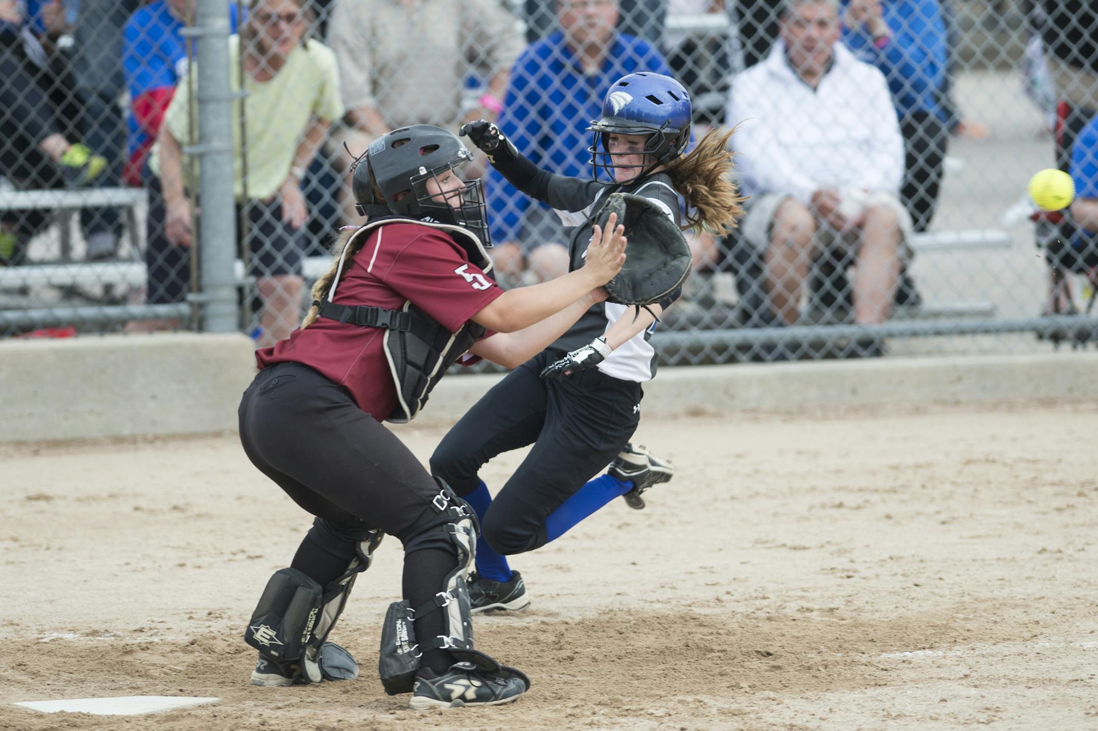 East view infielder Abby Lien slid in safely to home off an RBI hit by Sam Gall as Maple Grove catcher Hanna Lund tried to get the tag in the top of the fourth inning on their 3A semifinal game Thursday. ] Aaron Lavinsky • aaron.lavinsky@startribune.com The softball state tournament semifinals were held Thursday, June 4, 2015 at Caswell Park in Mankato.