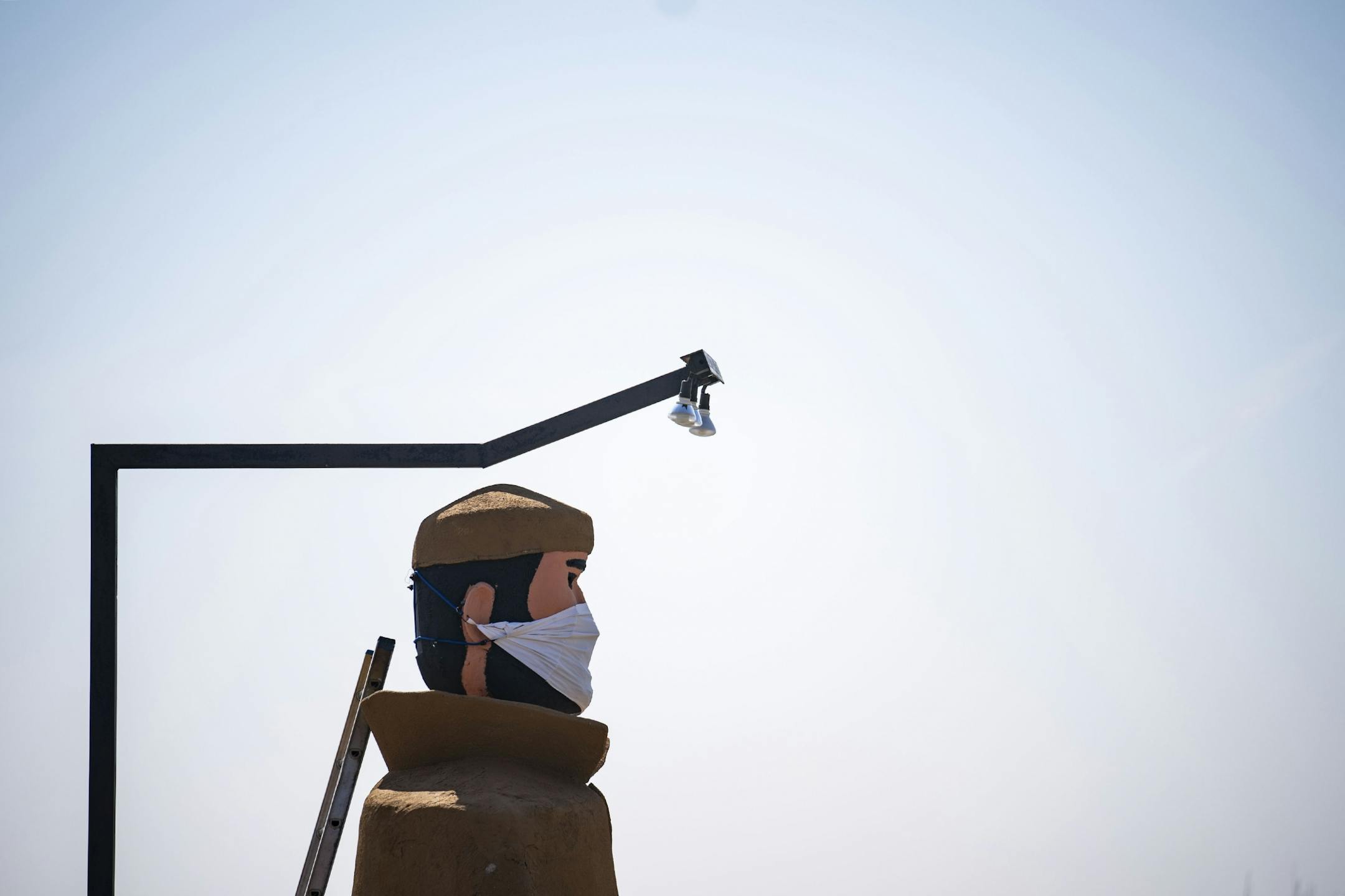 Pierre the Voyageur statue in Two Harbors, MN has been fitted with a mask amidst the COVID-19 pandemic and stood tall on April 23, 2020.