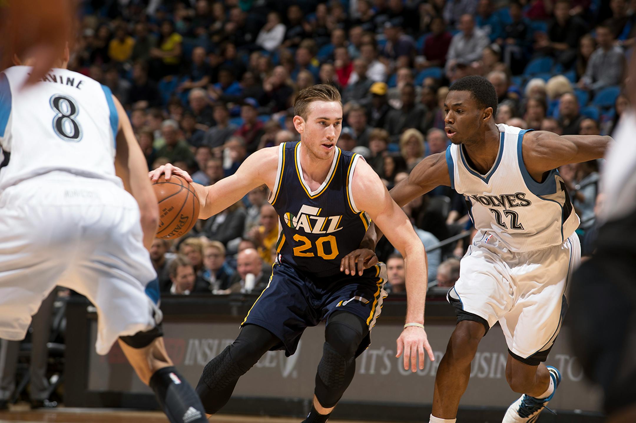 Utah Jazz forward Gordon Hayward (20) drives toward the basket while being defended by Minnesota Timberwolves forward Andrew Wiggins (22) during the first quarter.