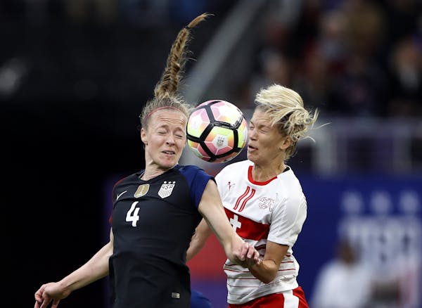 USA's Becky Sauerbrunn headed the ball away from Switzerland Lara Dickenmann in the first half at U.S. Bank Stadium Sunday October 23, 2016 in Minneap
