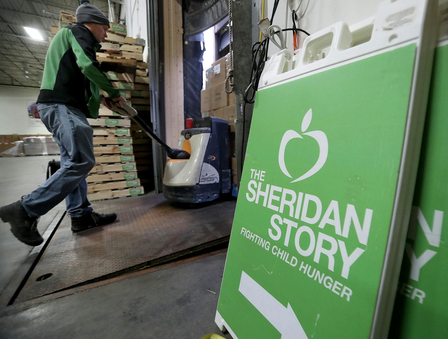 The Sheridan Story, a Roseville-based nonprofit, has distributed hundreds of thousands of meals to kids as schools in Minnesota remain shut down, including 168,000 meals in the last four days. Here, Casey Summers, a Sheridan Story warehouse worker and driver, moves a pallet of food to a truck at The Sheridan Story Tuesday, March 24, 2020 in Roseville, MN.] DAVID JOLES &#x2022; david.joles@startribune.com The Sheridan Story, a Roseville-based nonprofit, has distributed hundreds of thousands of me