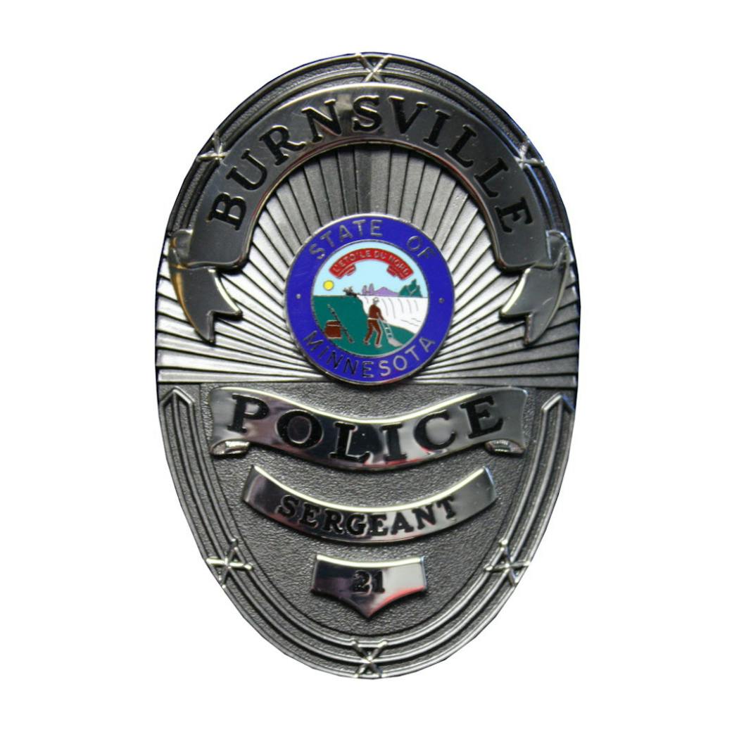The badge for Burnsville police officers features the current Minnesota state seal.