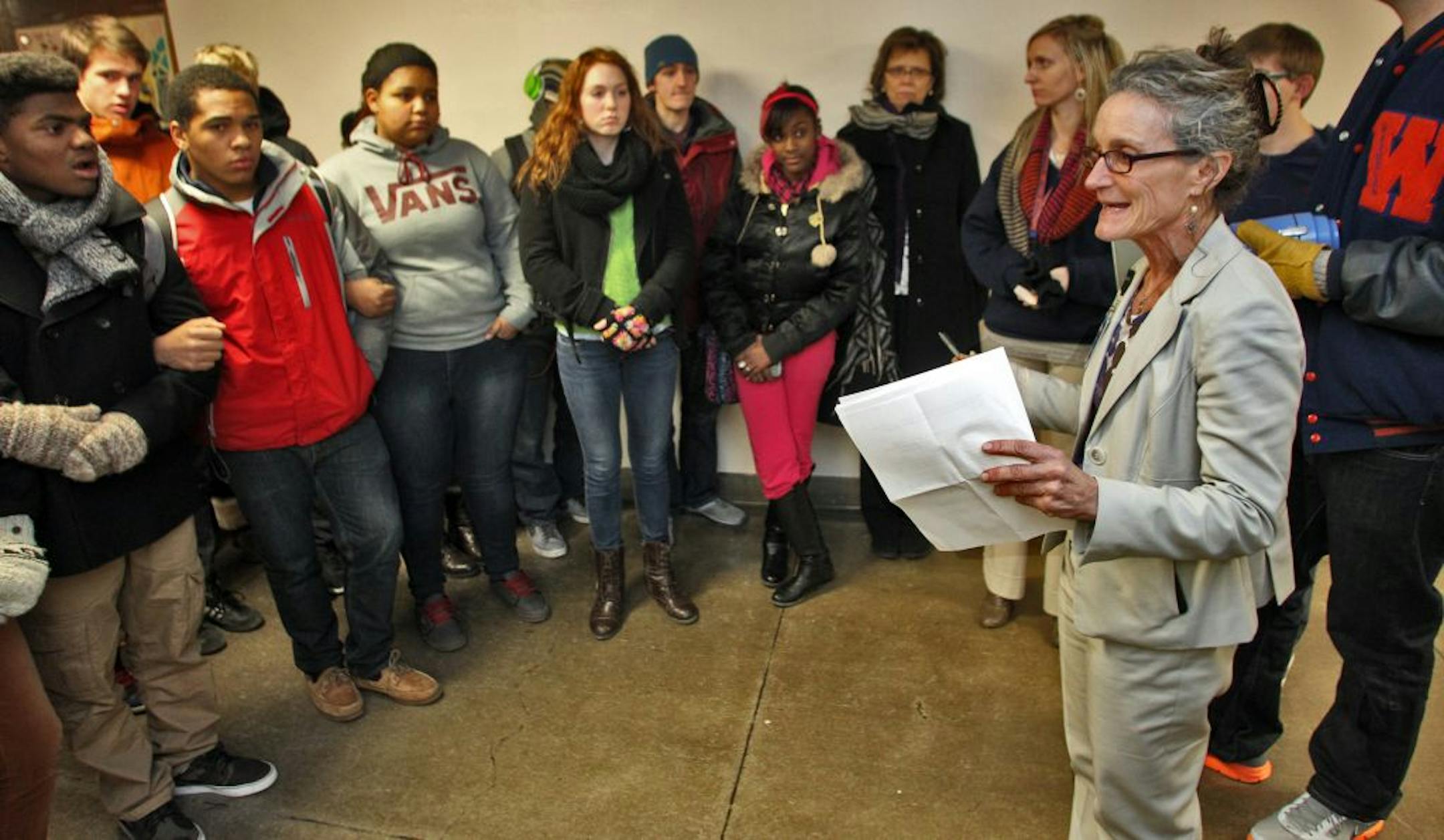 Washburn Principal Carol Markham-Cousins, right, met with students at the start of a community meeting Wednesday night to remind them of the seriousness of a recent doll-hanging incident at the school.