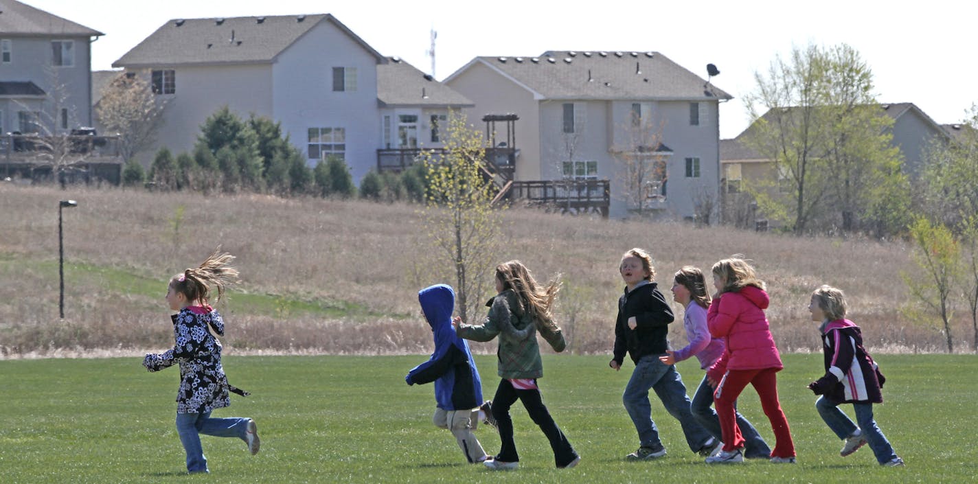 Meadowview Elementary School students took part in the lunch time run club started by P.E. instructor Joe McCarthy on 4/11/12. The Farmington MN. elementary school has started to incorporate physical activity in several different ways during the school day, including one minute warm-ups in the class and a lunch time running club that rewards students for running around the school's baseball fields and keeping track of their physical activity.] Bruce Bisping/Star Tribune bbisping@startribune.com