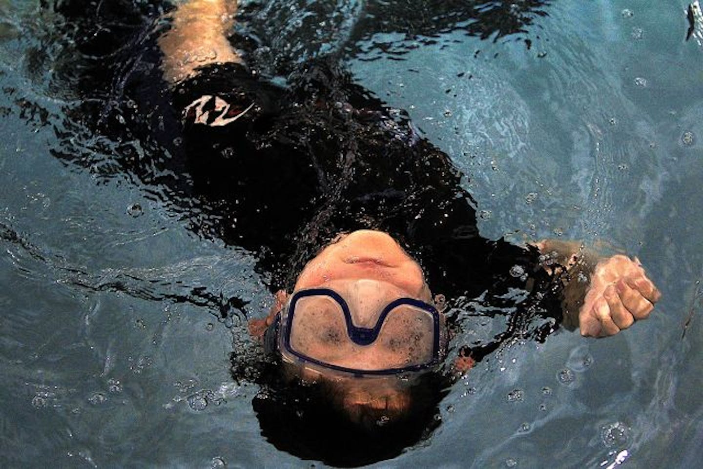 Clownfish Swim Club member Max Twogood spun in the water while doing the corkscrew, one his favorite swimming strokes.