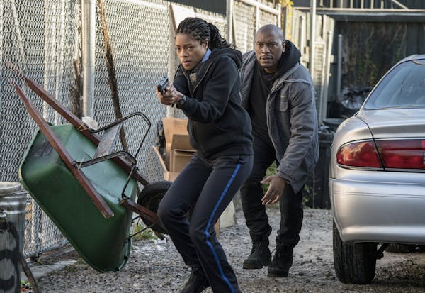 This image released by Sony Pictures shows Naomie Harris, left, and Tyrese Gibson in a scene from "Black and Blue," in theaters on Oct. 25. (Alan Mark