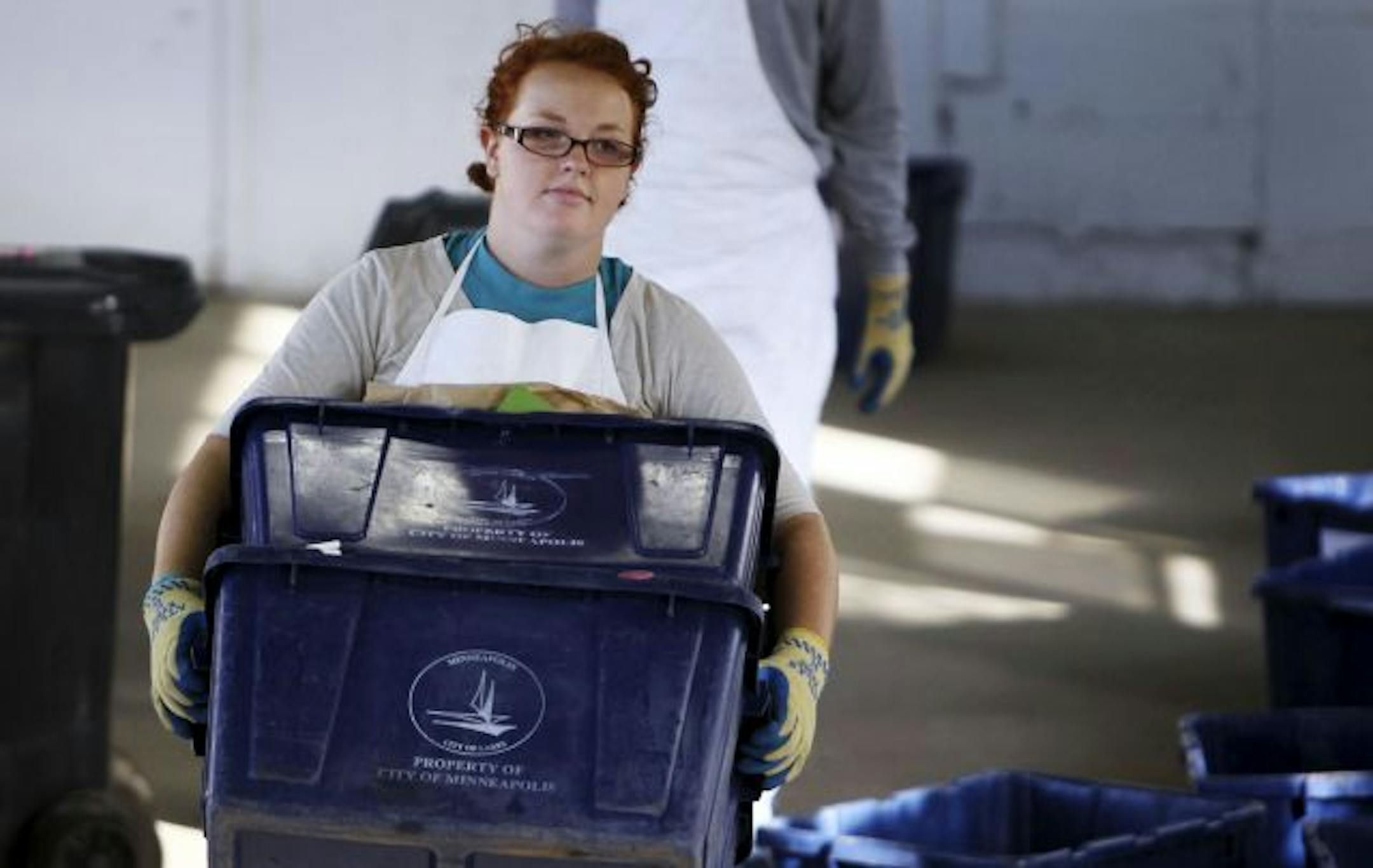 Jenna Sandoe carried bins of sorted recycling to be weighed.