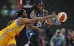 Lynx center Sylvia Fowles, right, and Sky forward Cheyenne Parker chased after a loose ball in the first quarter of Sunday&#x2019;s WNBA opener at Xce